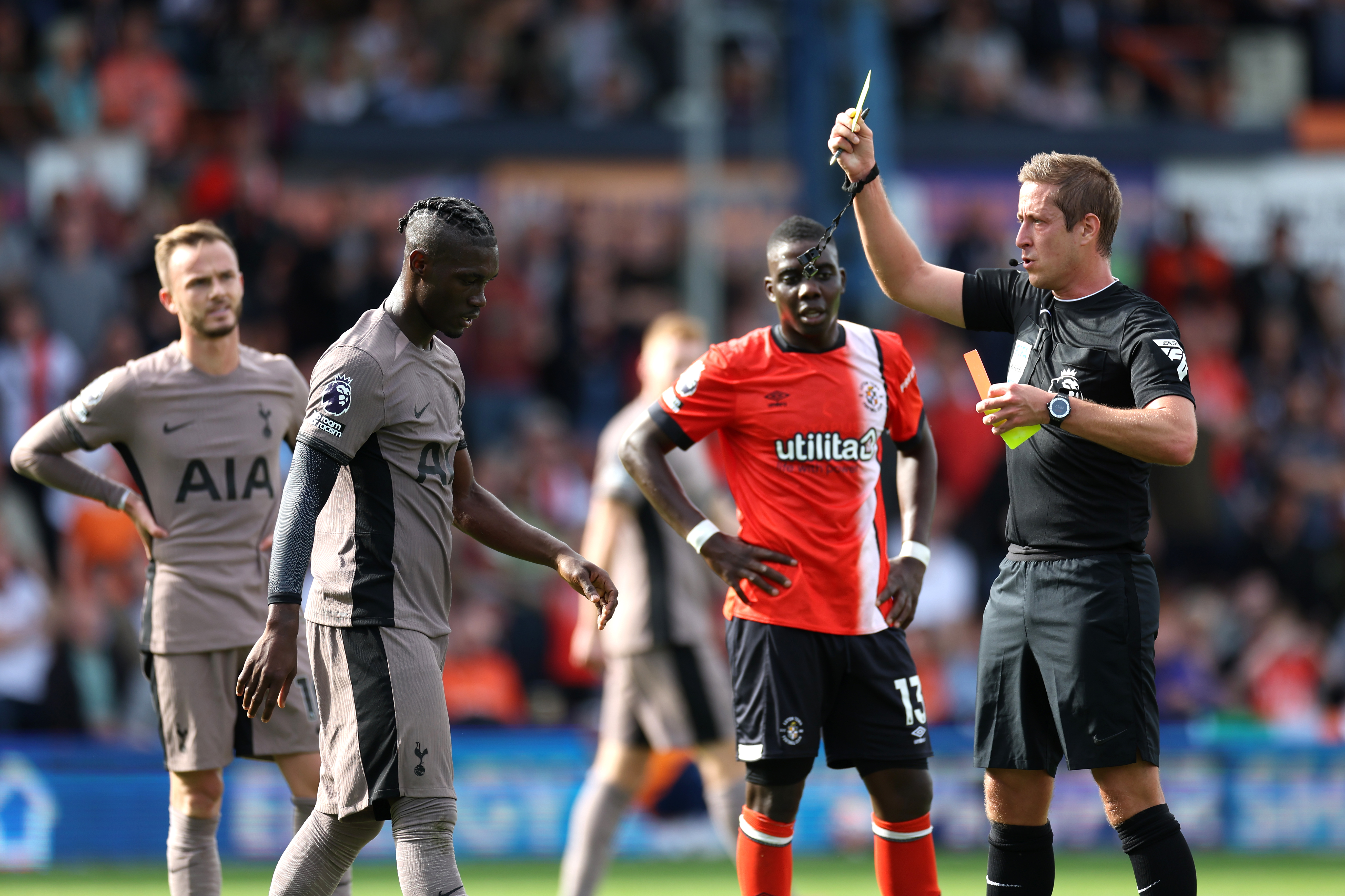 Yves Bissouma is shown a red card by referee John Brooks