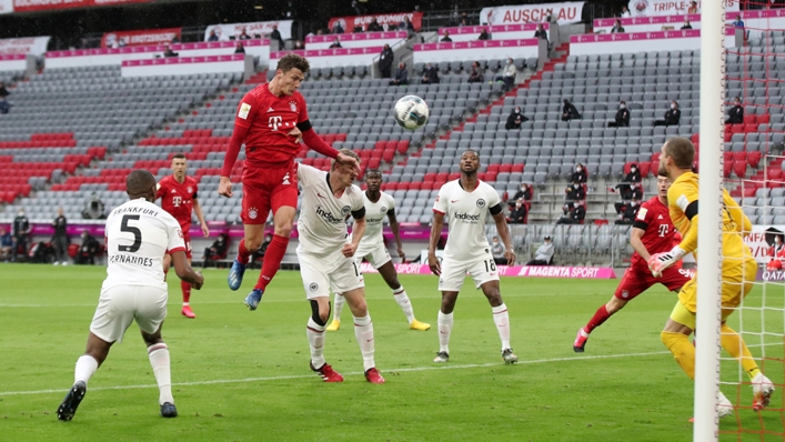 Benjamin Pavard heads at goal during a closed-doors Bundesliga game with Bayern Munich
