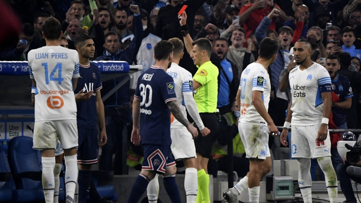 PSG's Achraf Hakimi (second left) receives a red card against Marseille