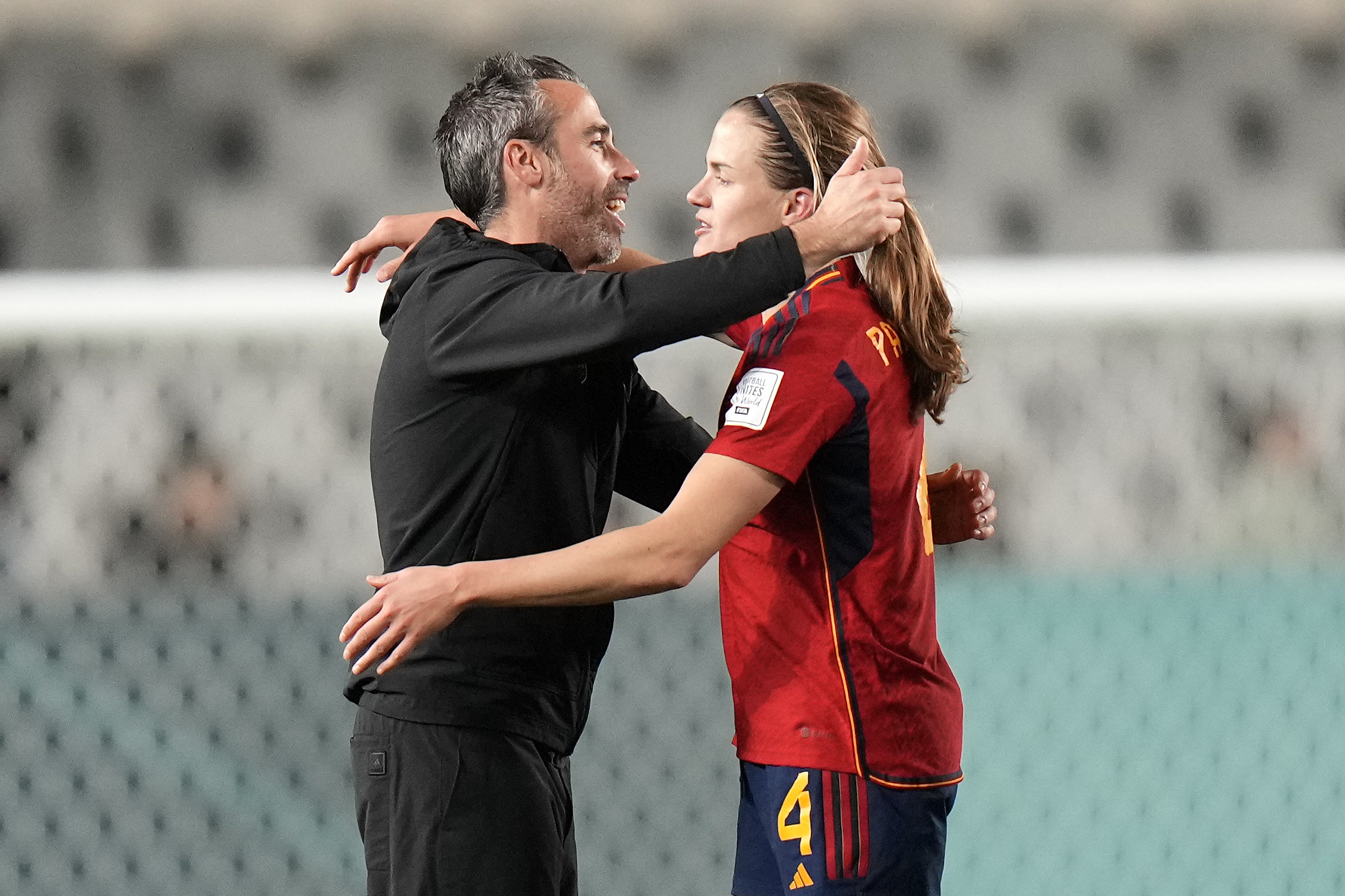 Spain’s Irene Paredes is embraced by Spain’s head coach Jorge Vilda