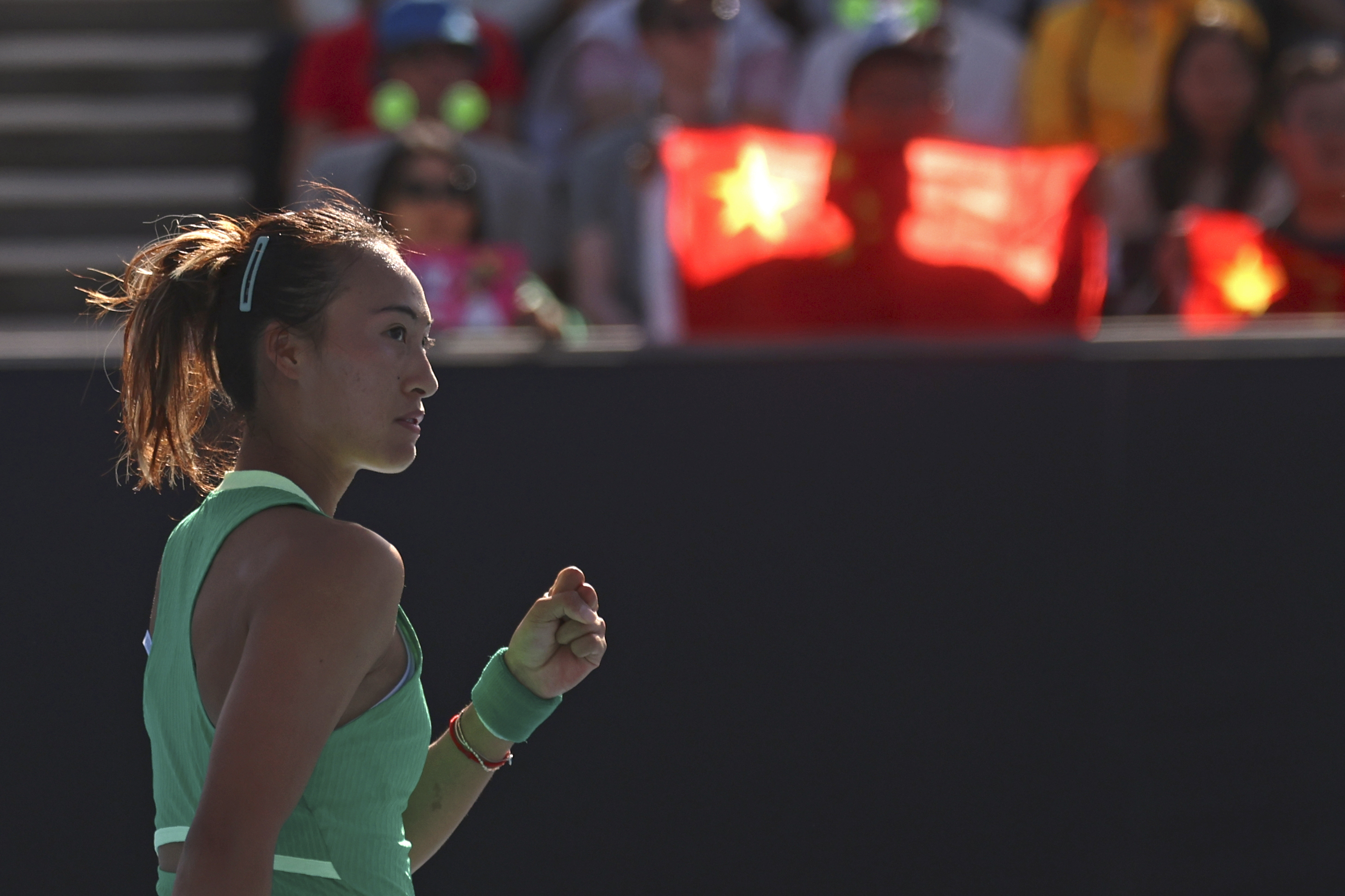 Zheng Qinwen clenches her fist
