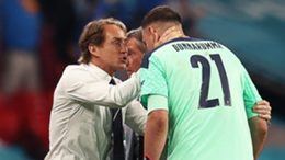 Italy's coach Roberto Mancini (L) celebrates with Italy's goalkeeper Gianluigi Donnarumma