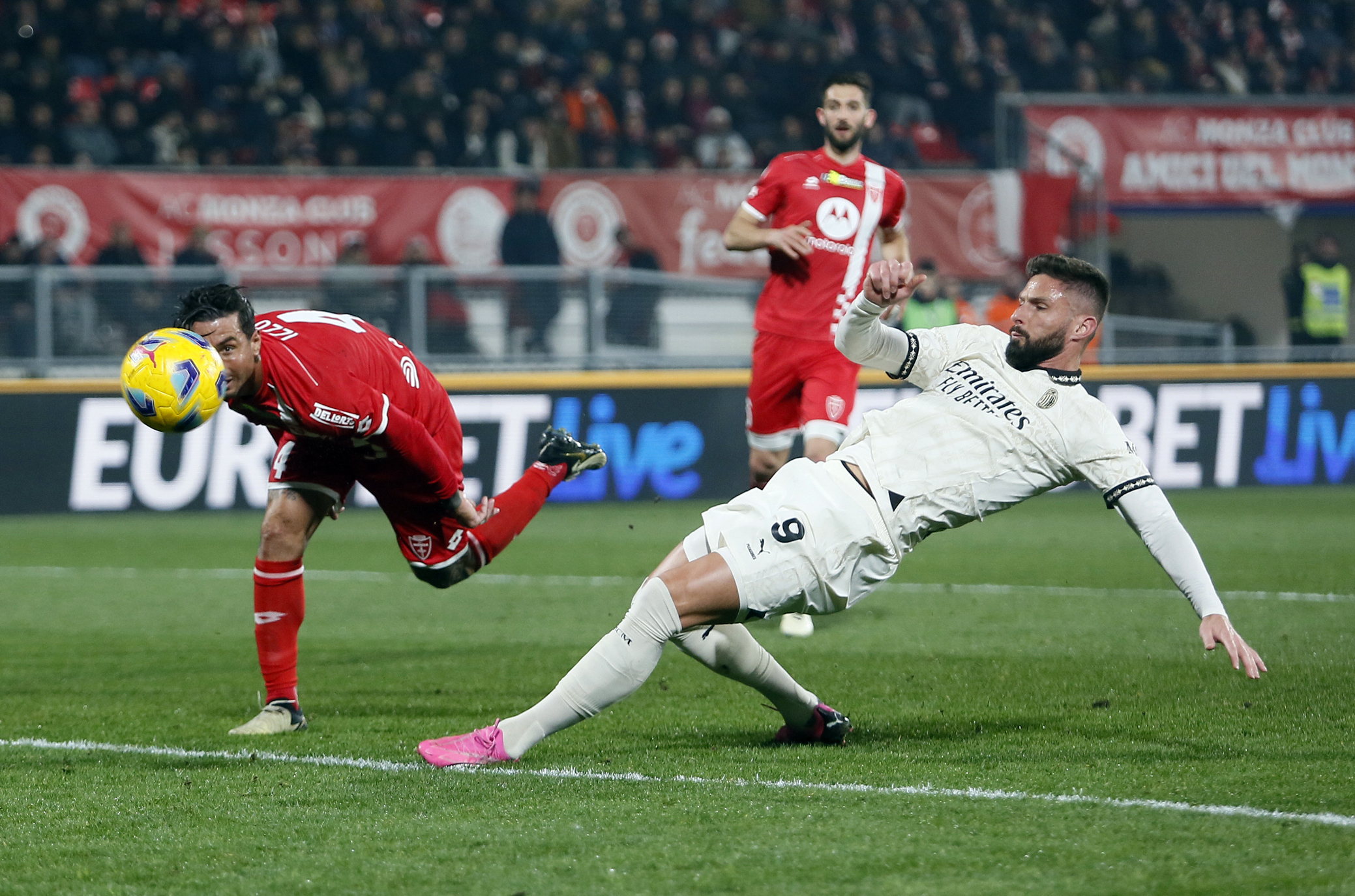 Milan’s Olivier Giroud (right) scores a goal
