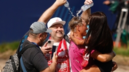 Adrian Meronk celebrates with his partner and team after winning the Australian Open