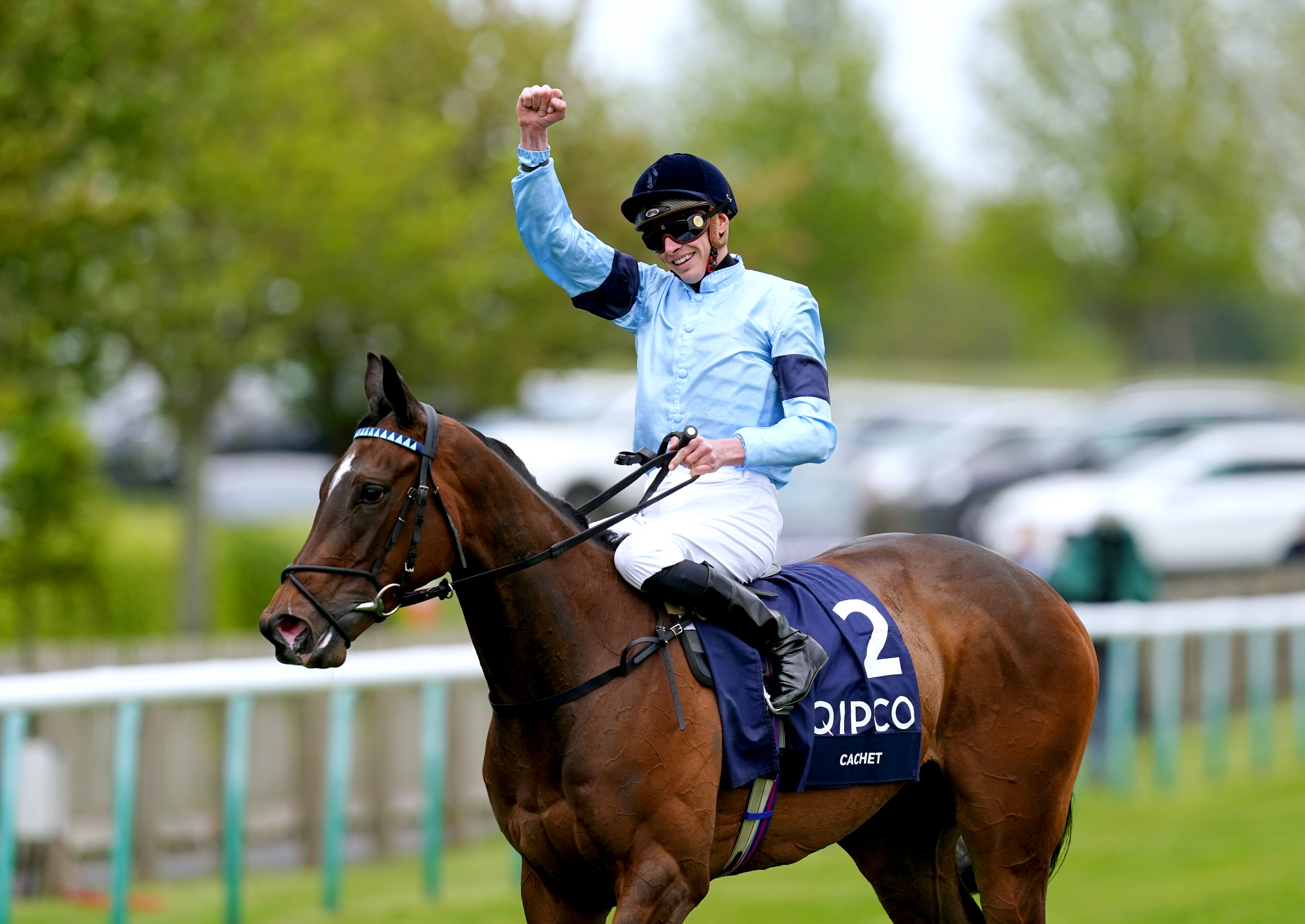 Jockey James Doyle celebrates on Cachet after winning the 1000 Guineas