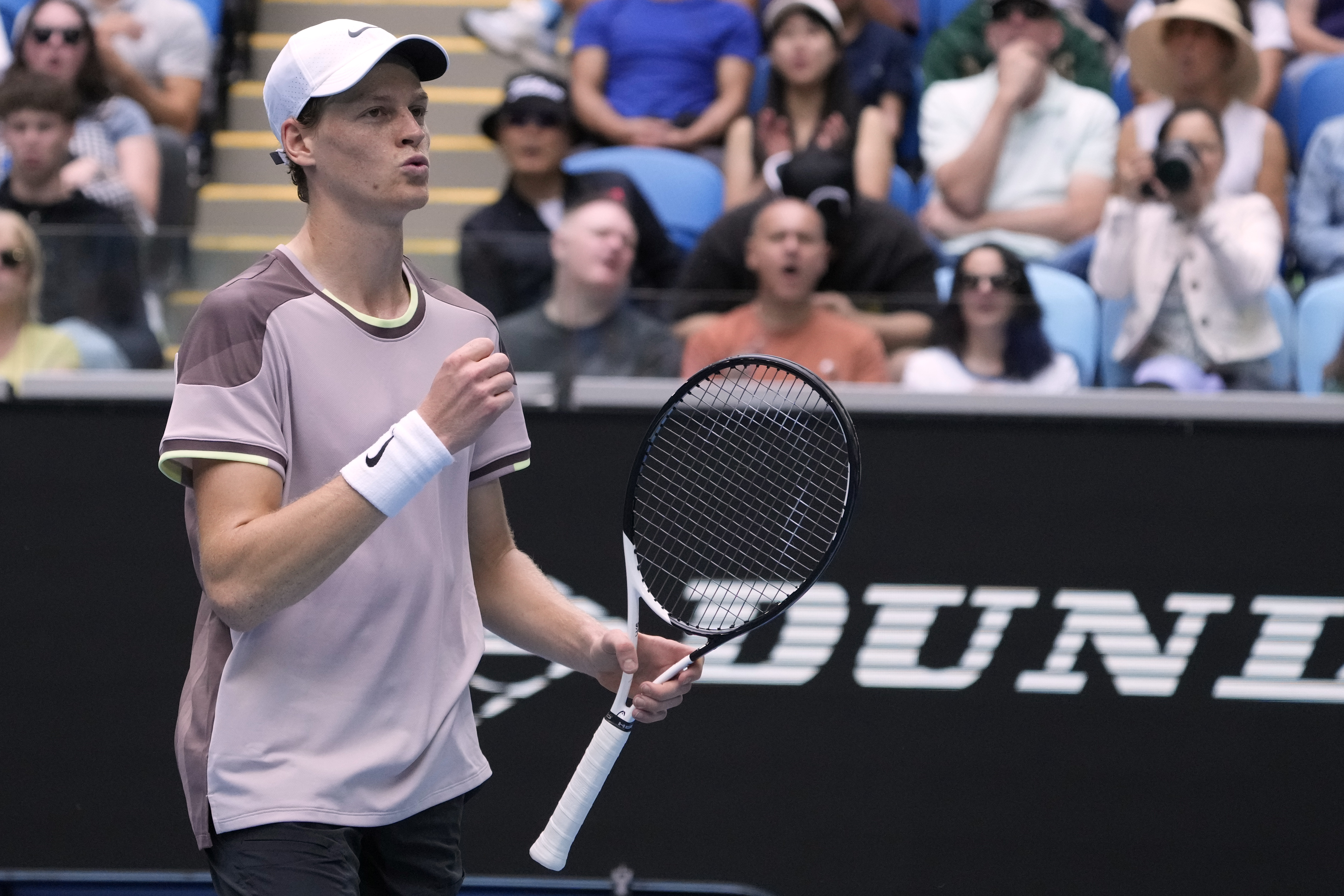 Jannik Sinner reacts after defeating Sebastian Baez