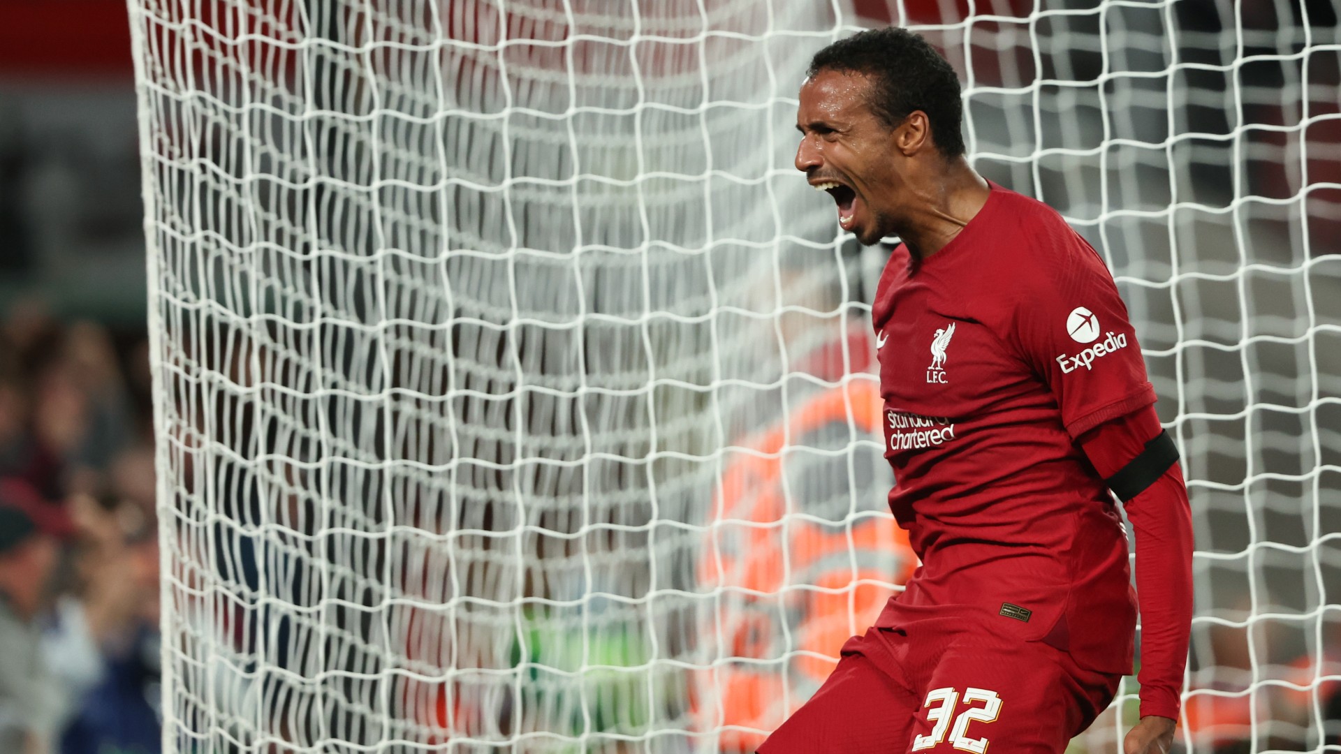 Joel Matip celebrates his late goal at Anfield