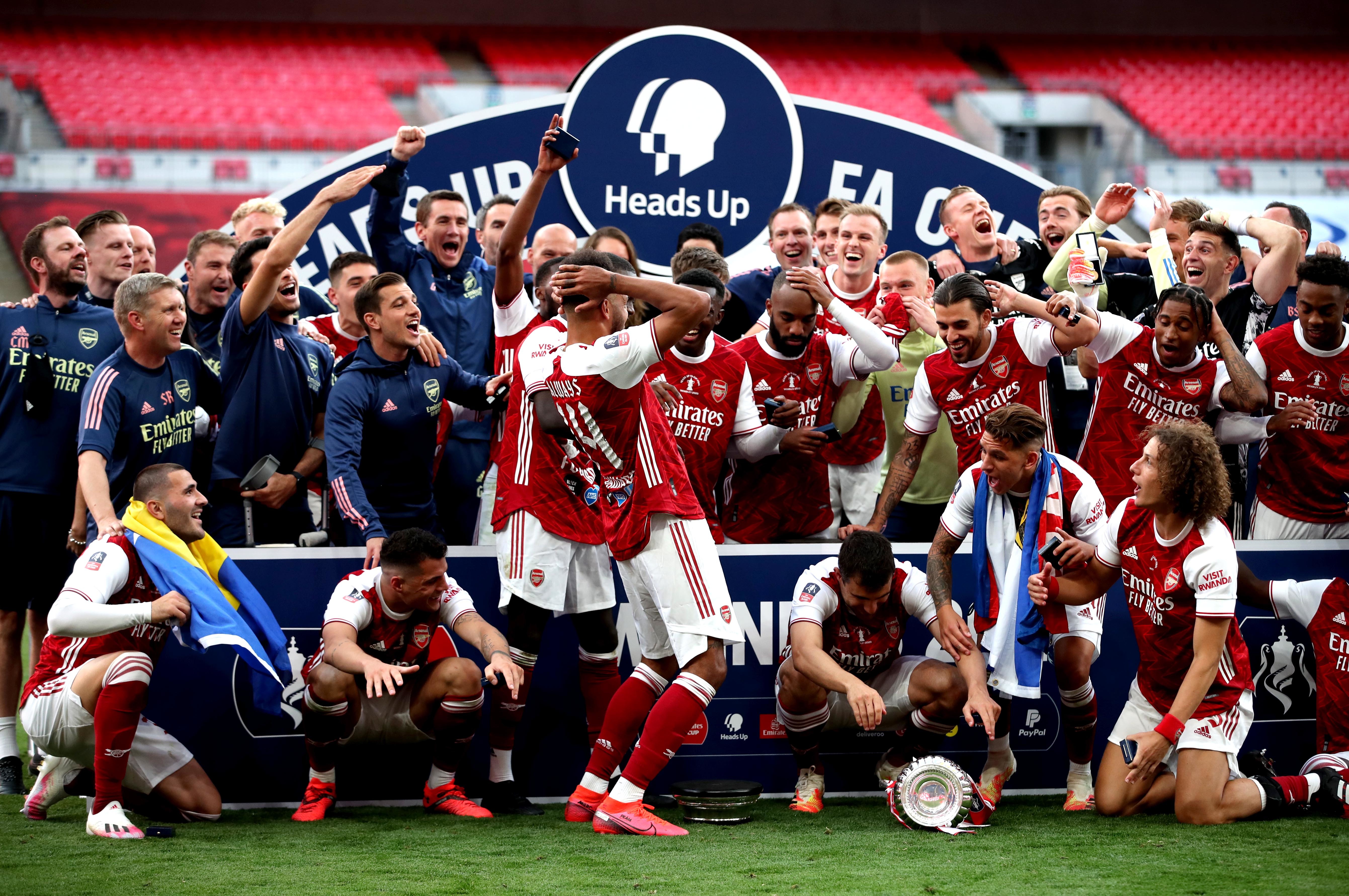 Pierre-Emerick Aubameyang, centre, left, dropped the FA Cup trophy (Adam Davy/PA)
