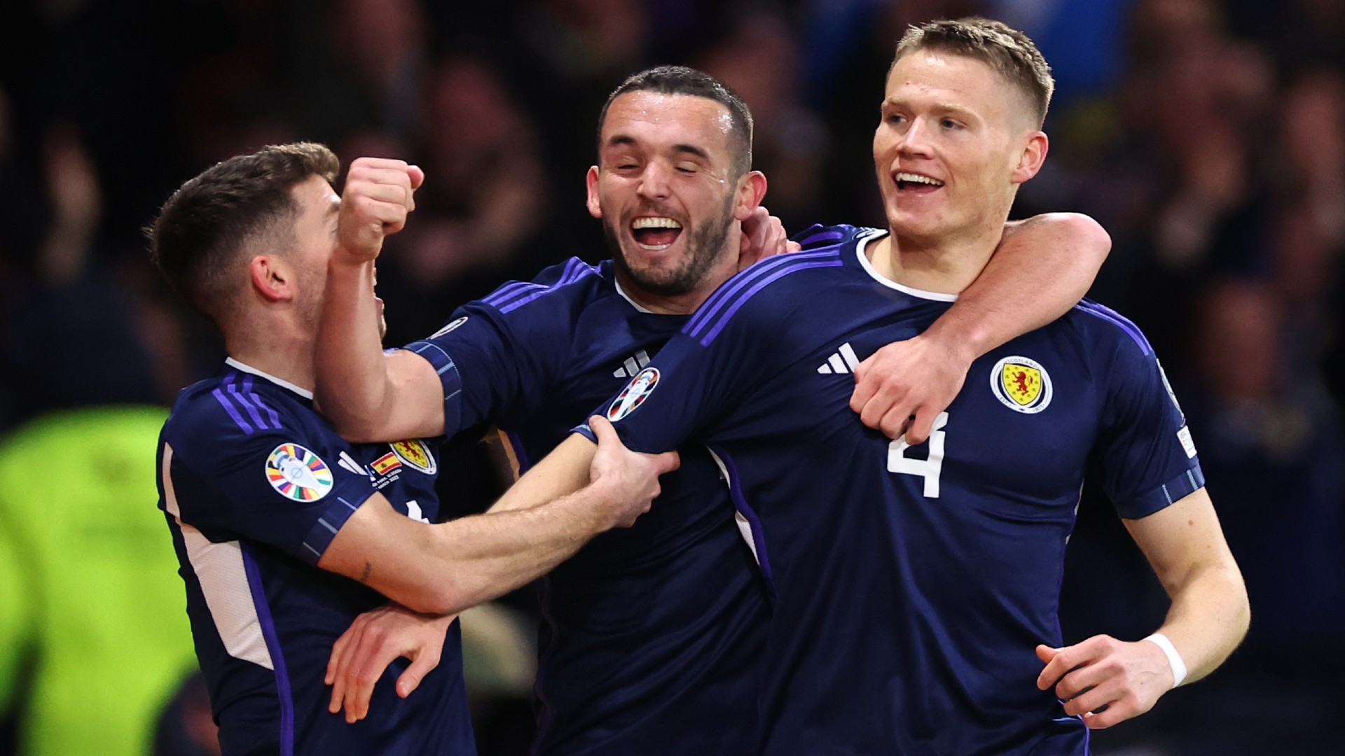 Scott McTominay celebrates with his Scotland team-mates after scoring against Spain
