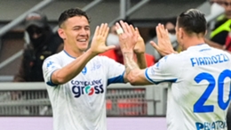 Kristjan Asllani (L) celebrates scoring against Inter