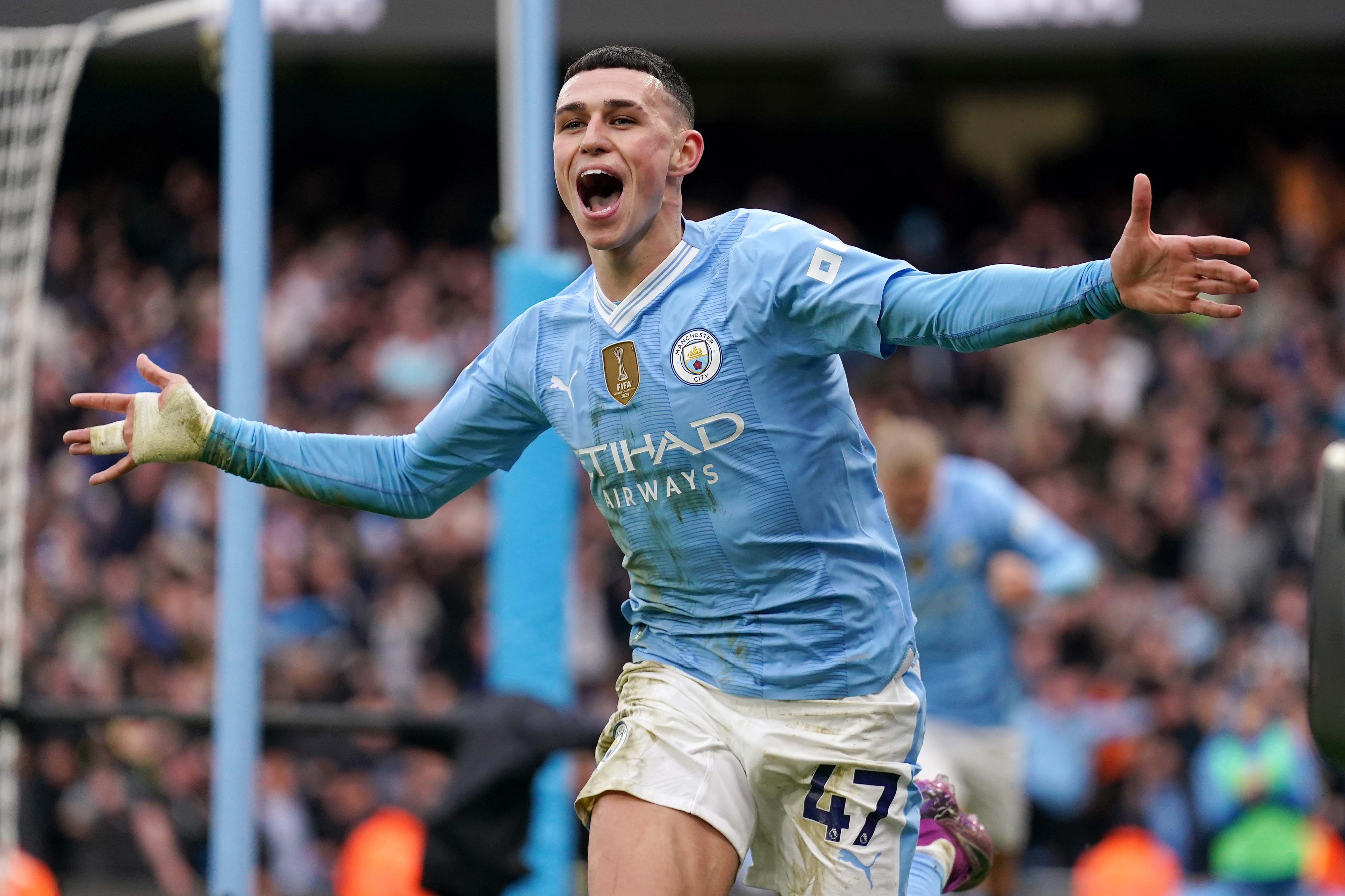 Phil Foden celebrates scoring against Manchester United