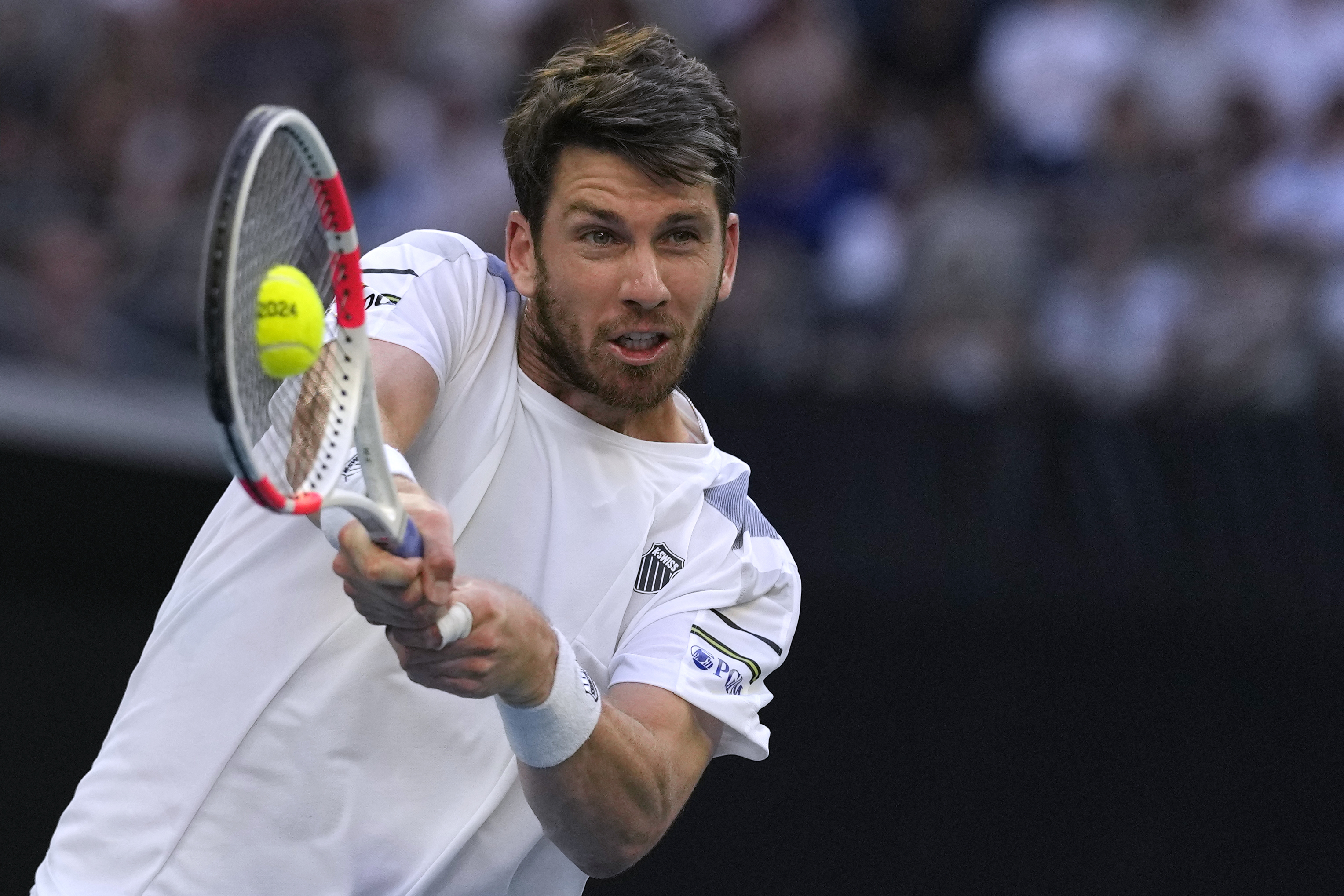Cameron Norrie hits a backhand