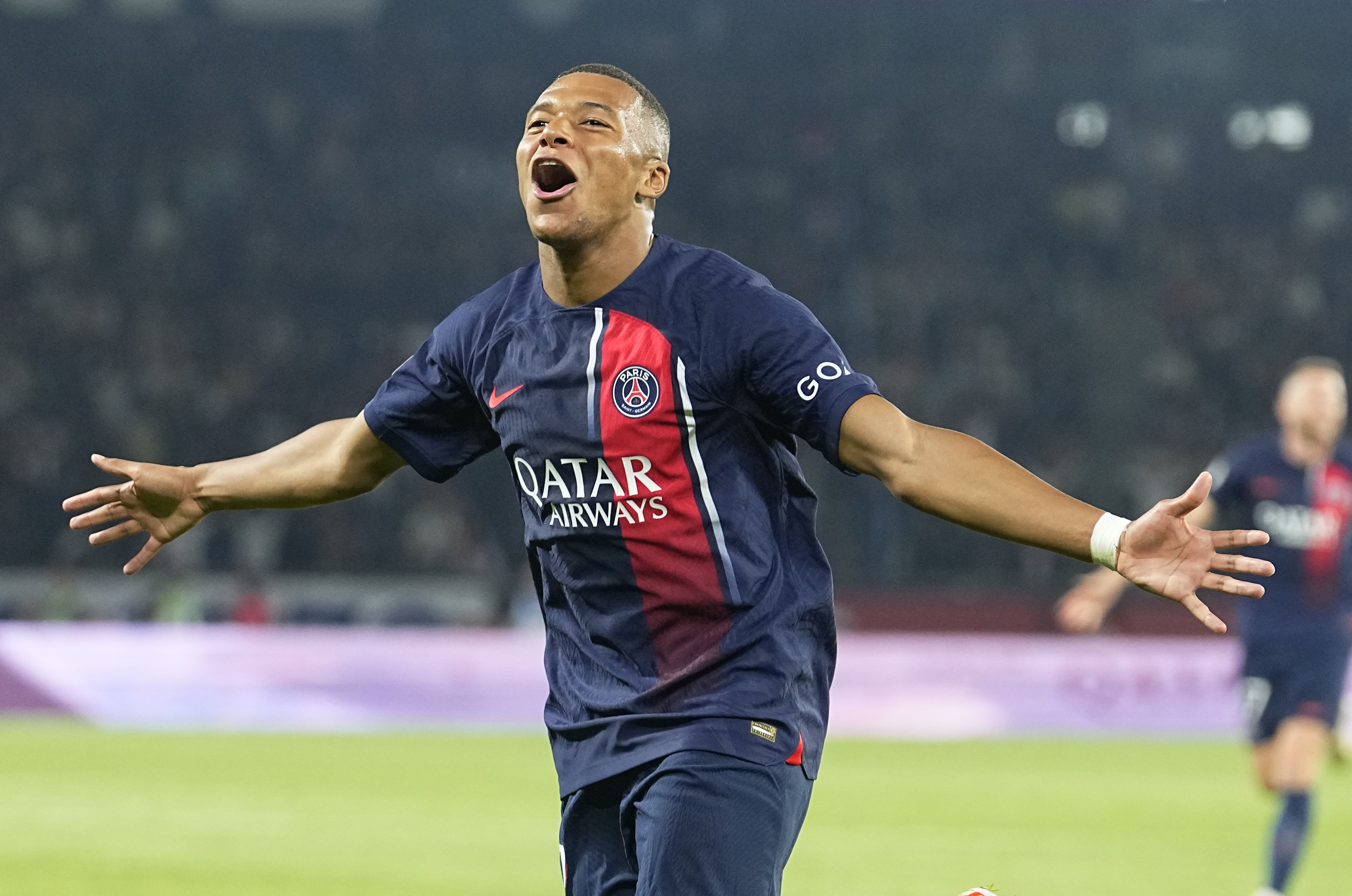 Kylian Mbappe celebrates scoring his first goals of the season for Paris St Germain