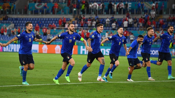 Italy's players celebrate after beating Switzerland