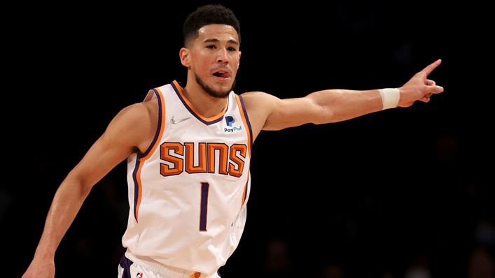 Devin Booker of the Phoenix Suns celebrates his three point shot in the first half against the Brooklyn Nets at Barclays Center