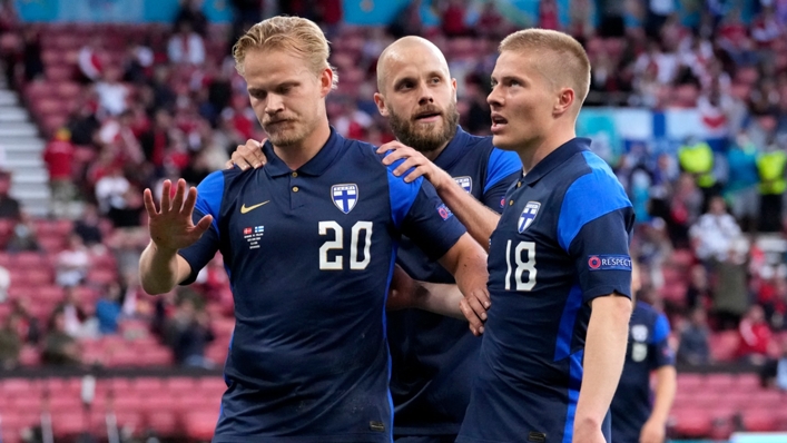 Finland's Jeol Pohjanpalo (left) refuses to celebrate his goal against Denmark following the collapse of Christian Eriksen