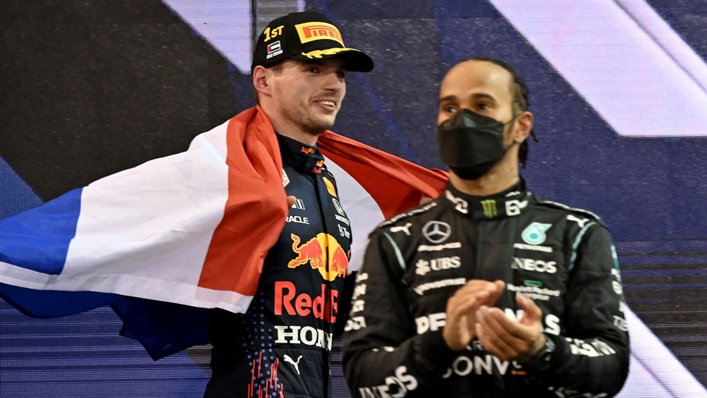 Lewis Hamilton applauds as Max Verstappen celebrates in Abu Dhabi
