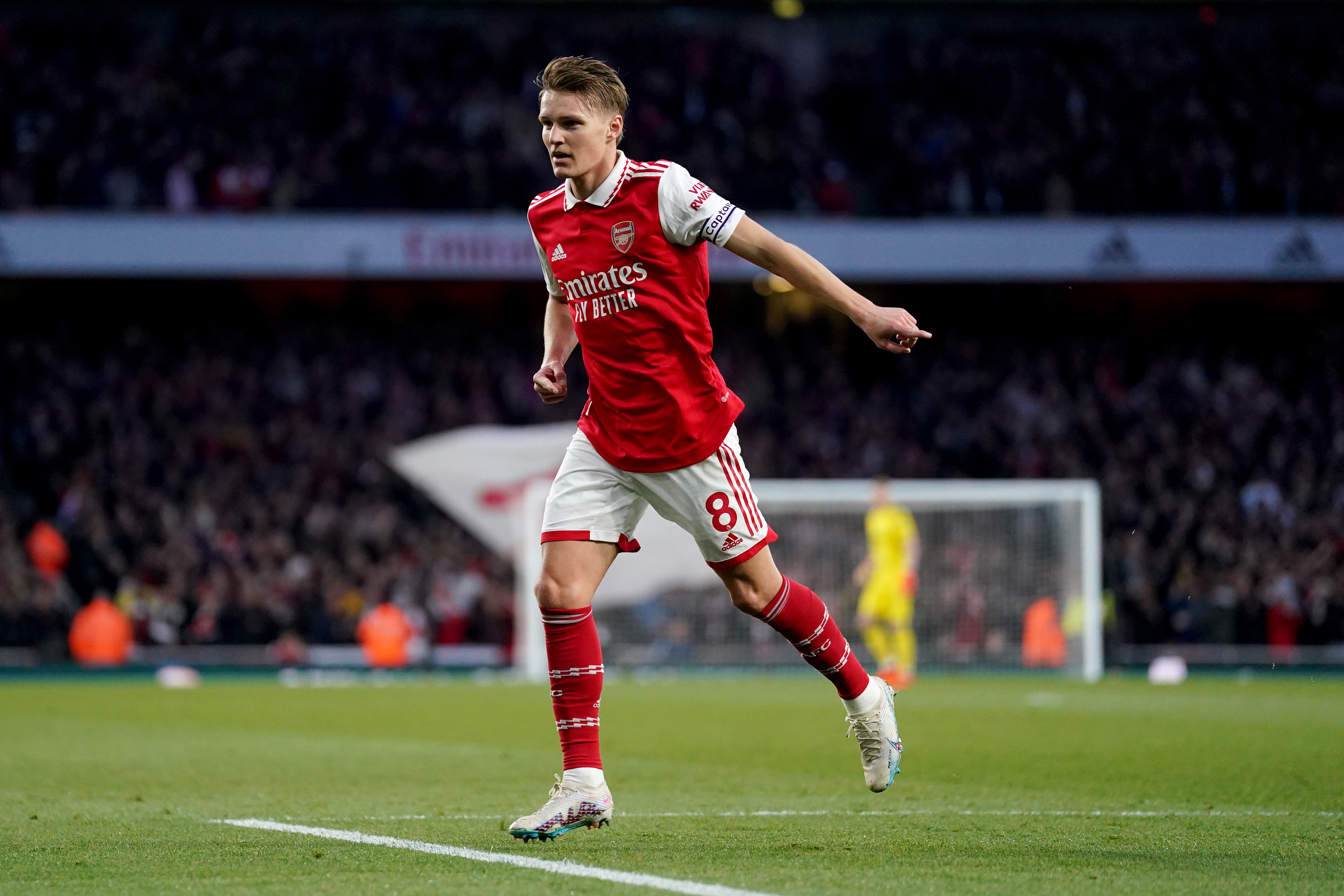 Arsenal's Martin Odegaard celebrates after scoring their side's first goal during the Premier League match at the Emirates Stadium, London