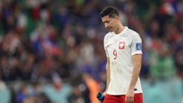 Robert Lewandowski leaves the field after Poland are knocked out of the 2022 World Cup by France