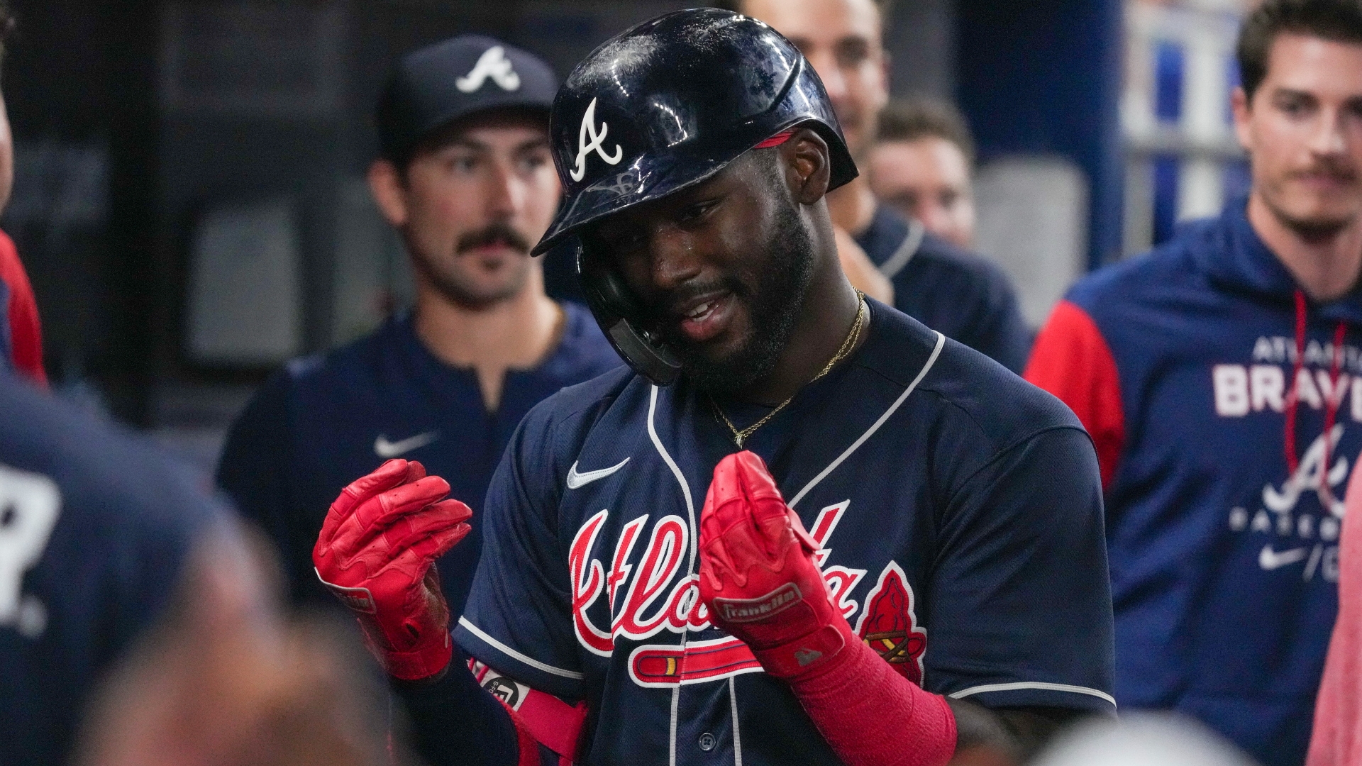 Atlanta Braves rookie Michael Harris II makes the money gesture with his hands after his home run on Sunday