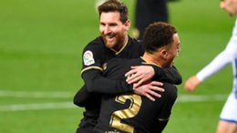 Lionel Messi celebrates with Sergino Dest
