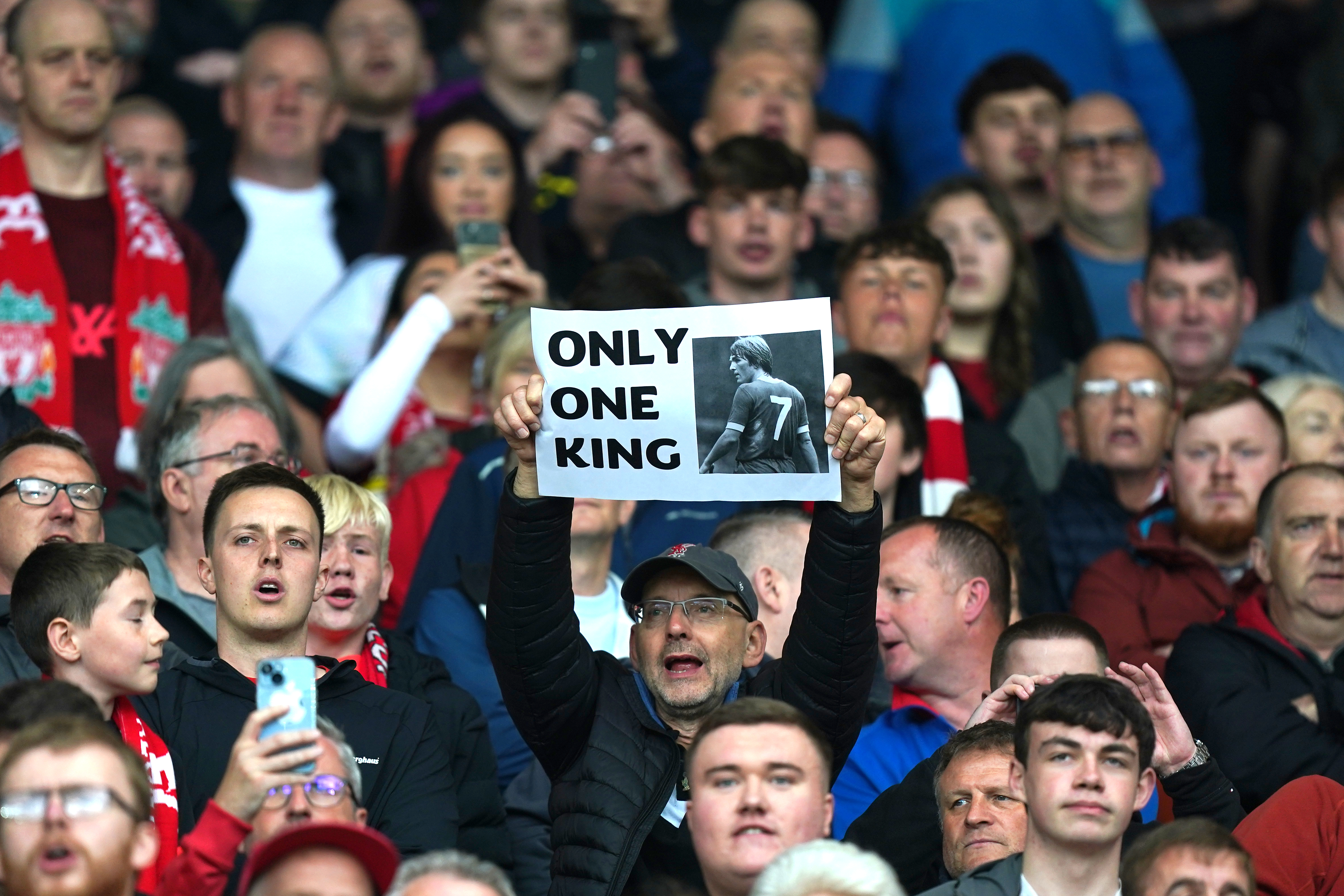 Liverpool fans hold up a sign saying ‘Only One King’ before the Premier League match against Brentford at Anfield