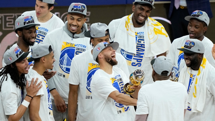 Stephen Curry is greeted by teammates after winning the Western Conference Finals MVP award