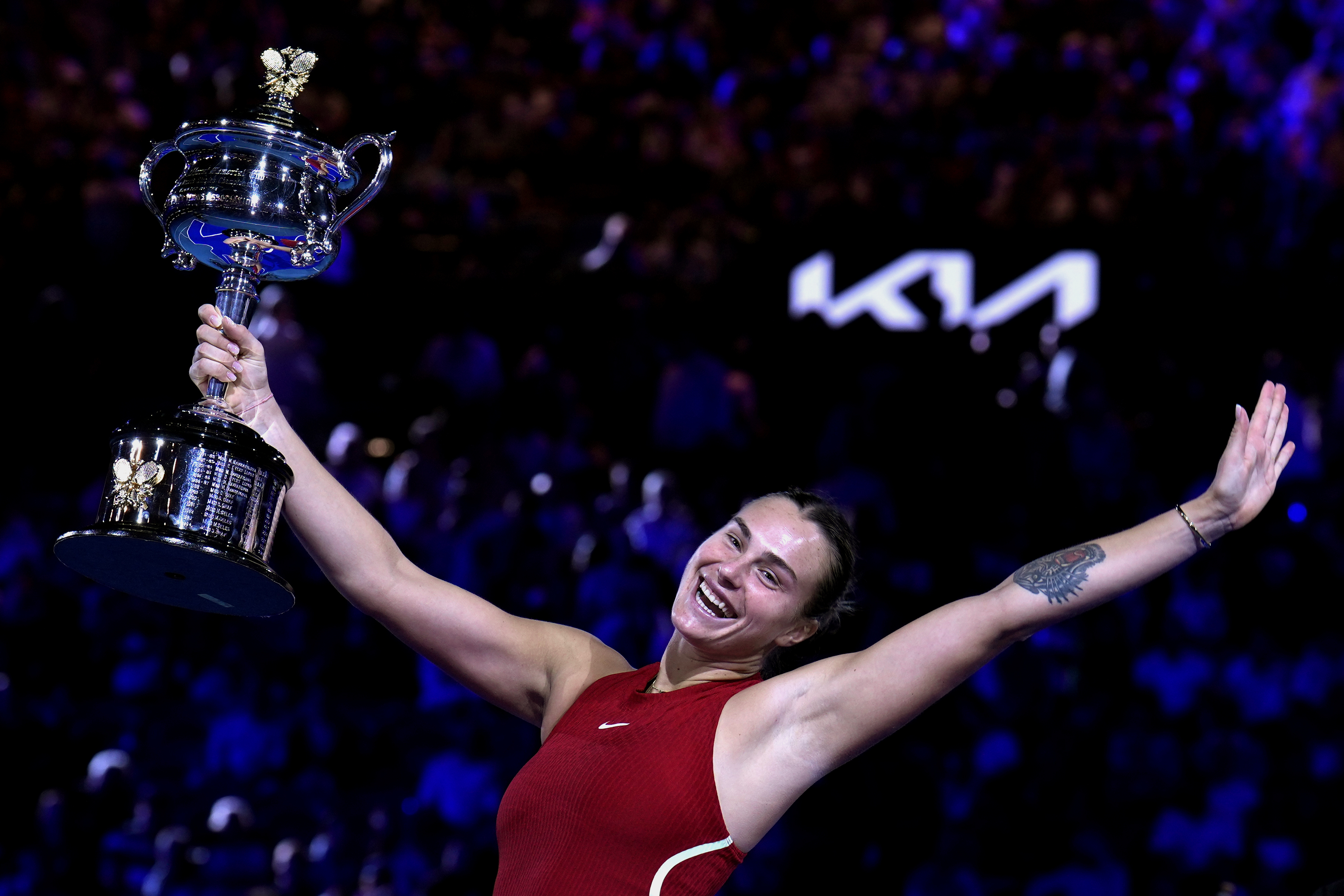 Aryna Sabalenka holds the Daphne Akhurst Memorial Cup