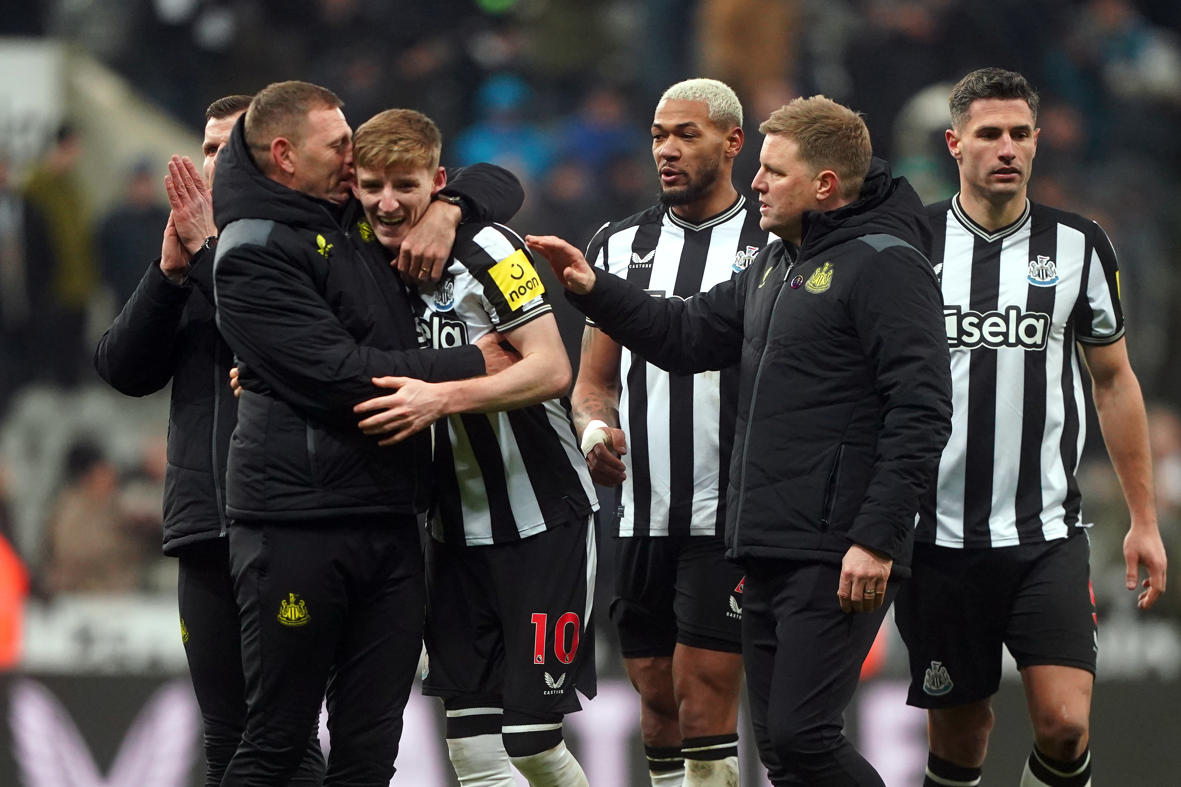 Newcastle’s Anthony Gordon (centre) is congratulated by head coach Eddie Howe following the 1-0 win over Manchester United