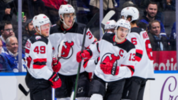 Nico Hischier of the New Jersey Devils celebrates his goal against the Toronto Maple Leafs with teammates Fabian Zetterlund, Ryan Graves and John Marino