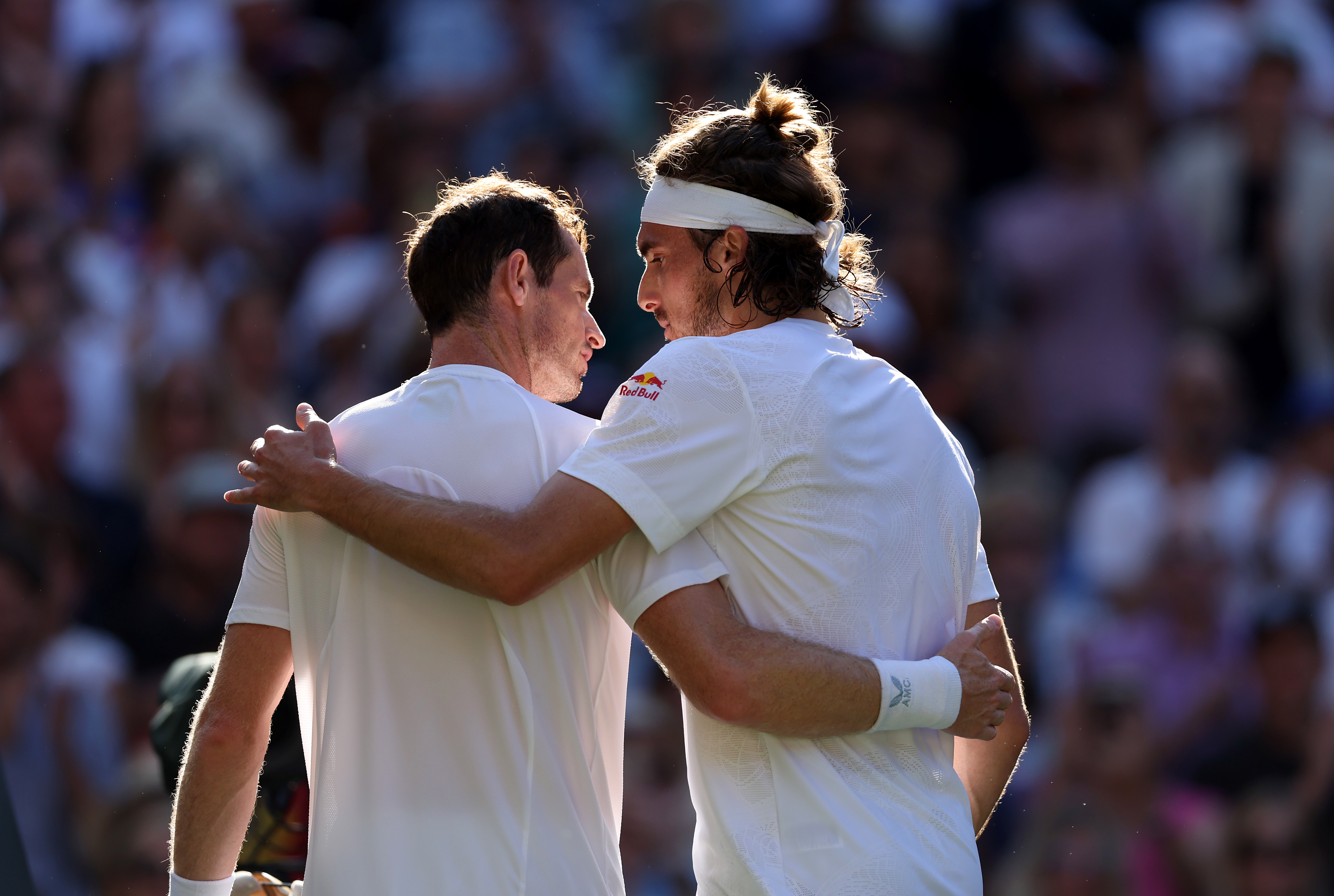 Andy Murray, left, and Stefanos Tsitsipas embrace after their match at Wimbledon