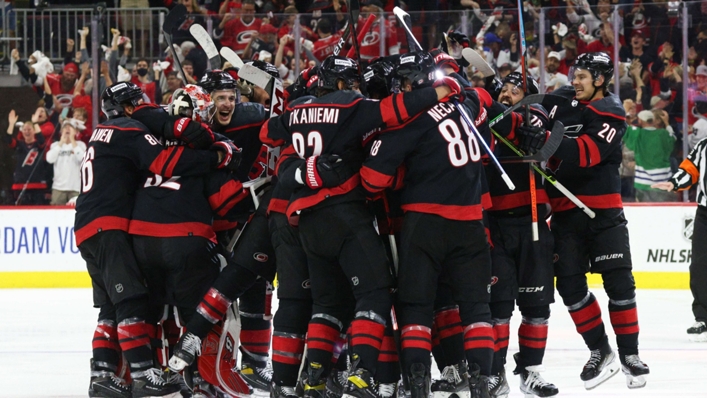Hurricanes team-mate swarm Ian Cole after his winner