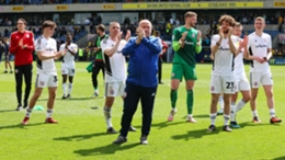 Accrington manager John Coleman and his players applaud the supporters after relegation was confirmed (Kieran Cleeves/PA)