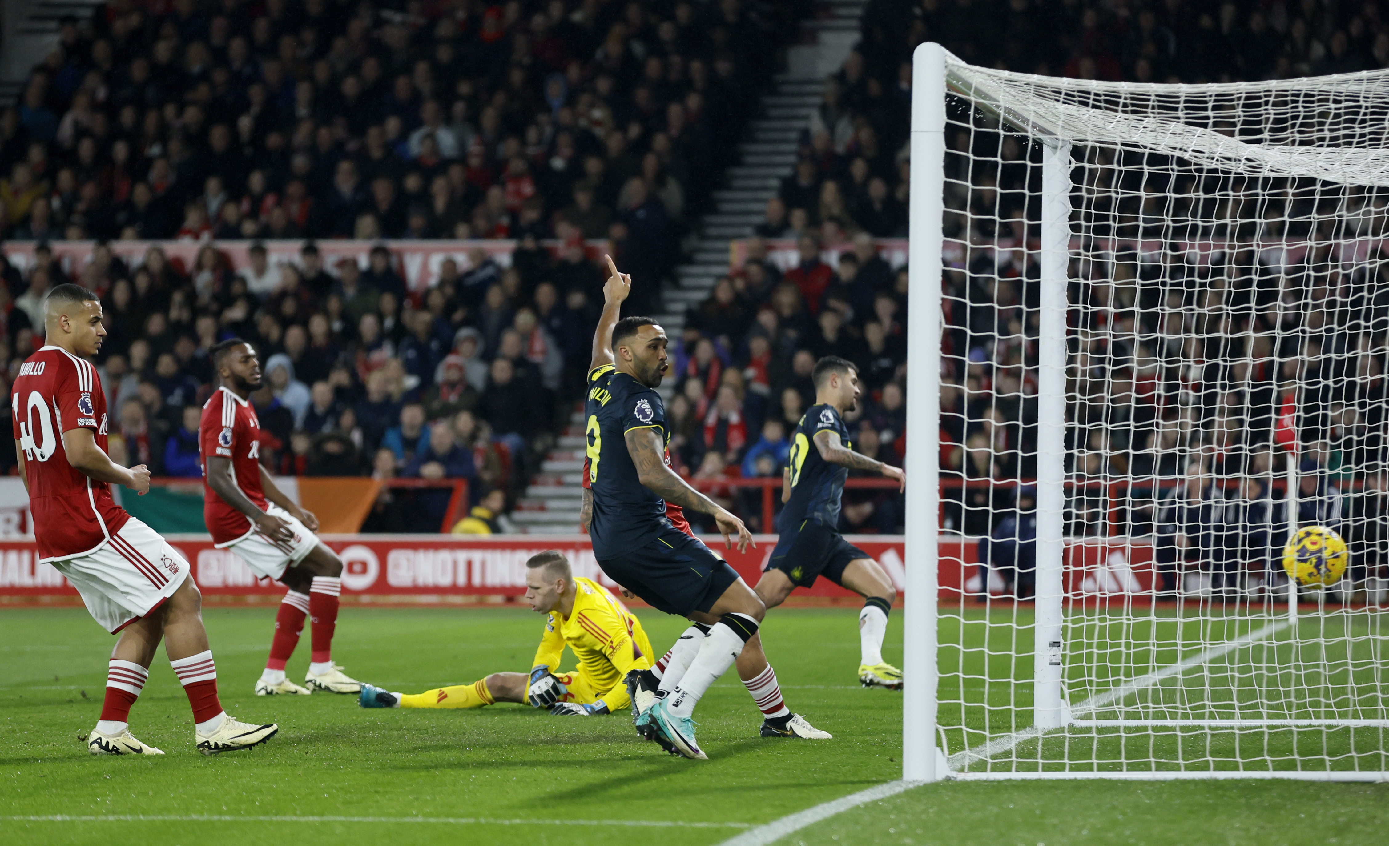 Bruno Guimaraes, background right, scores the opening goal