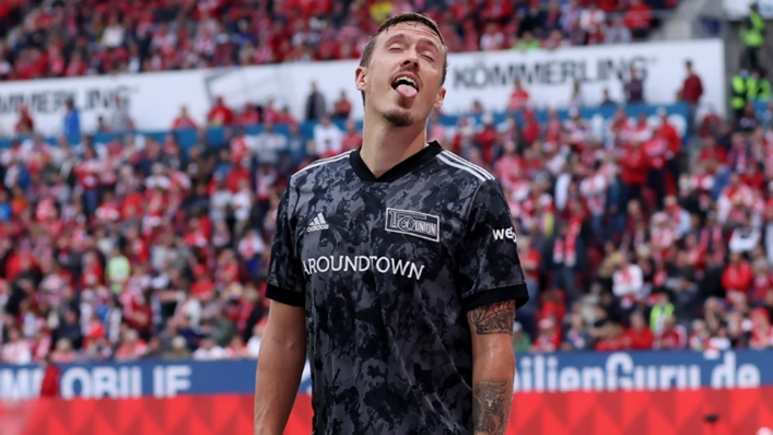 Max Kruse reacts to being showered in beer