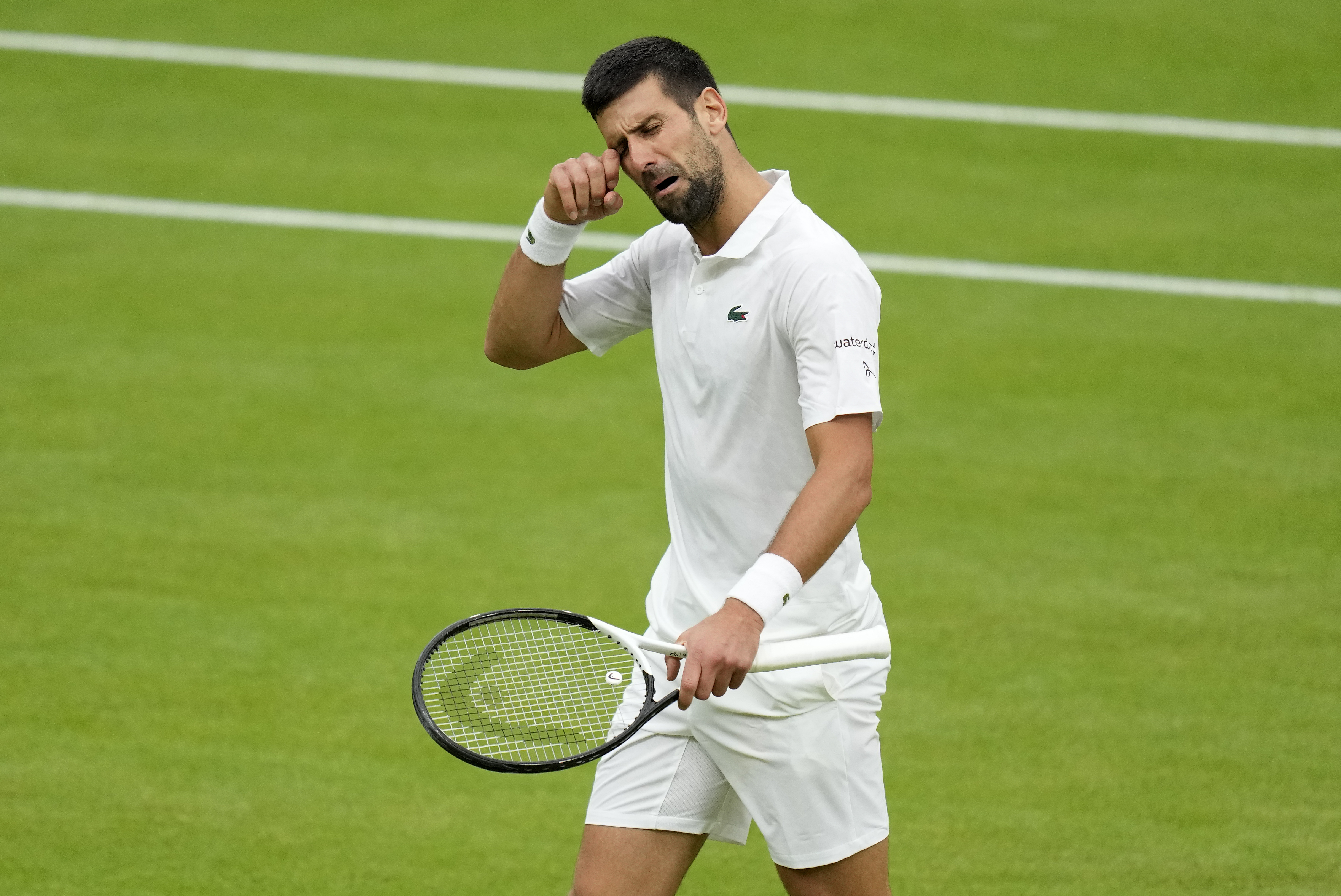 Novak Djokovic mimes crying after a spat with the crowd