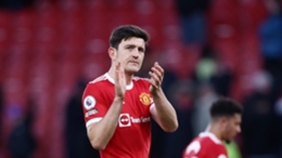 Harry Maguire applauds the Manchester United supporters