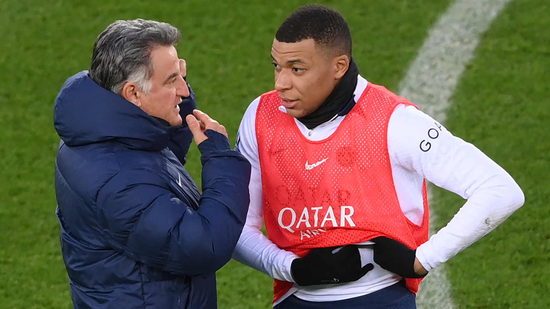 Christophe Galtier (L) speaks to Kylian Mbappe (R) at Paris Saint-Germain's open training session