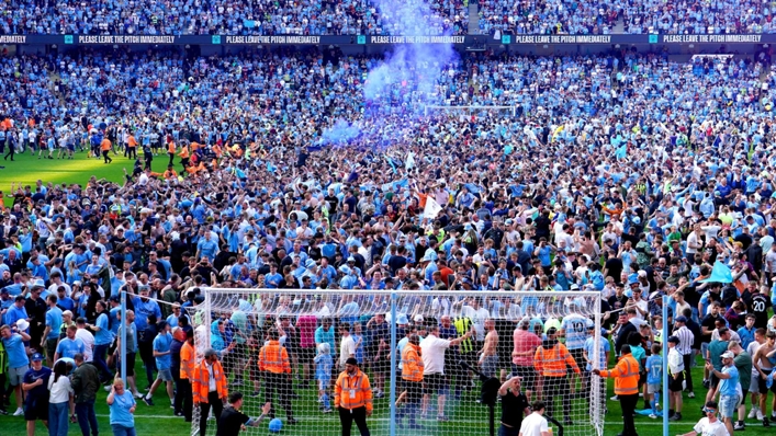 Manchester City fans celebrate their title success (Martin Rickett/PA)