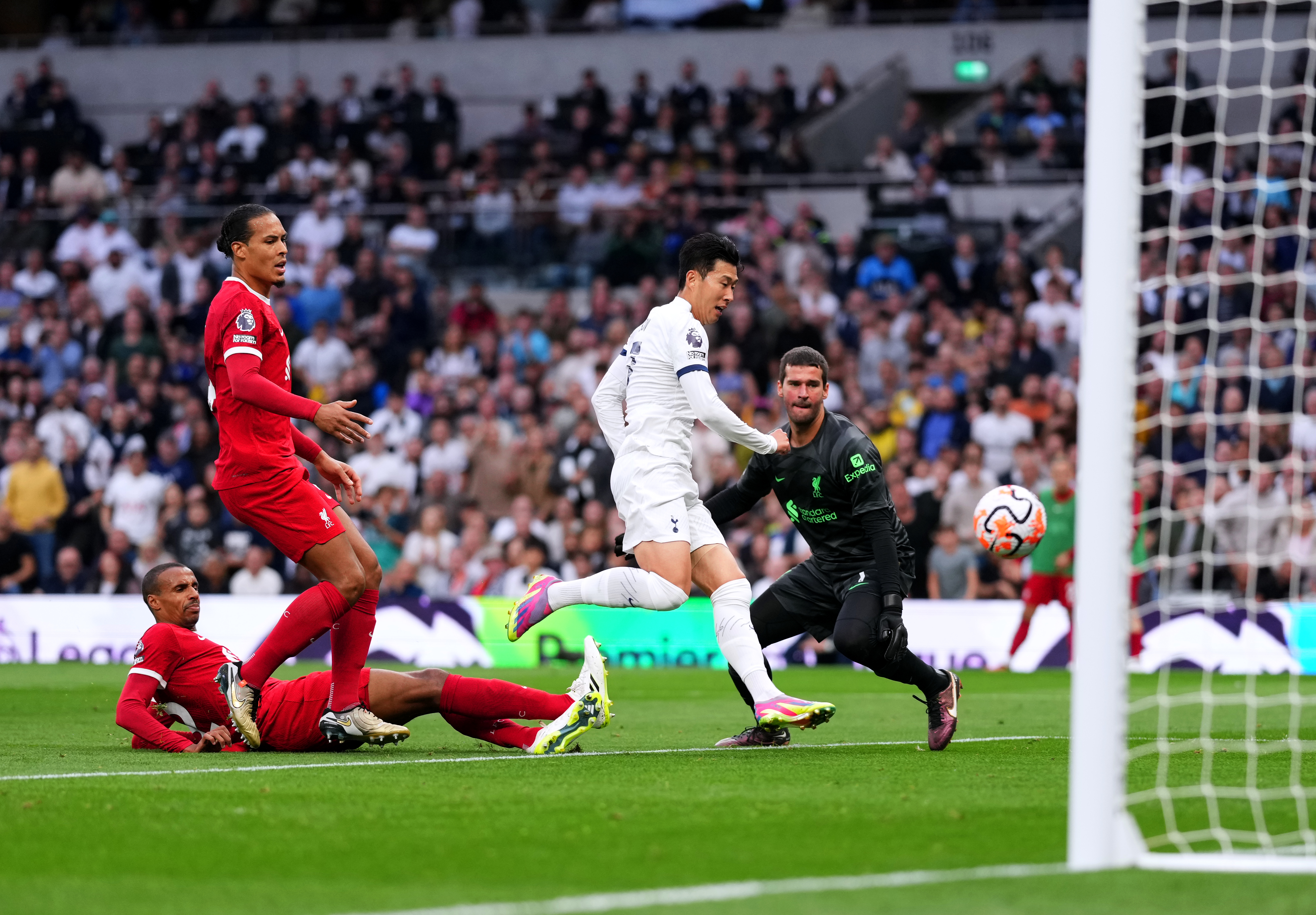 Tottenham claim dramatic last-gasp victory over nine-man Liverpool