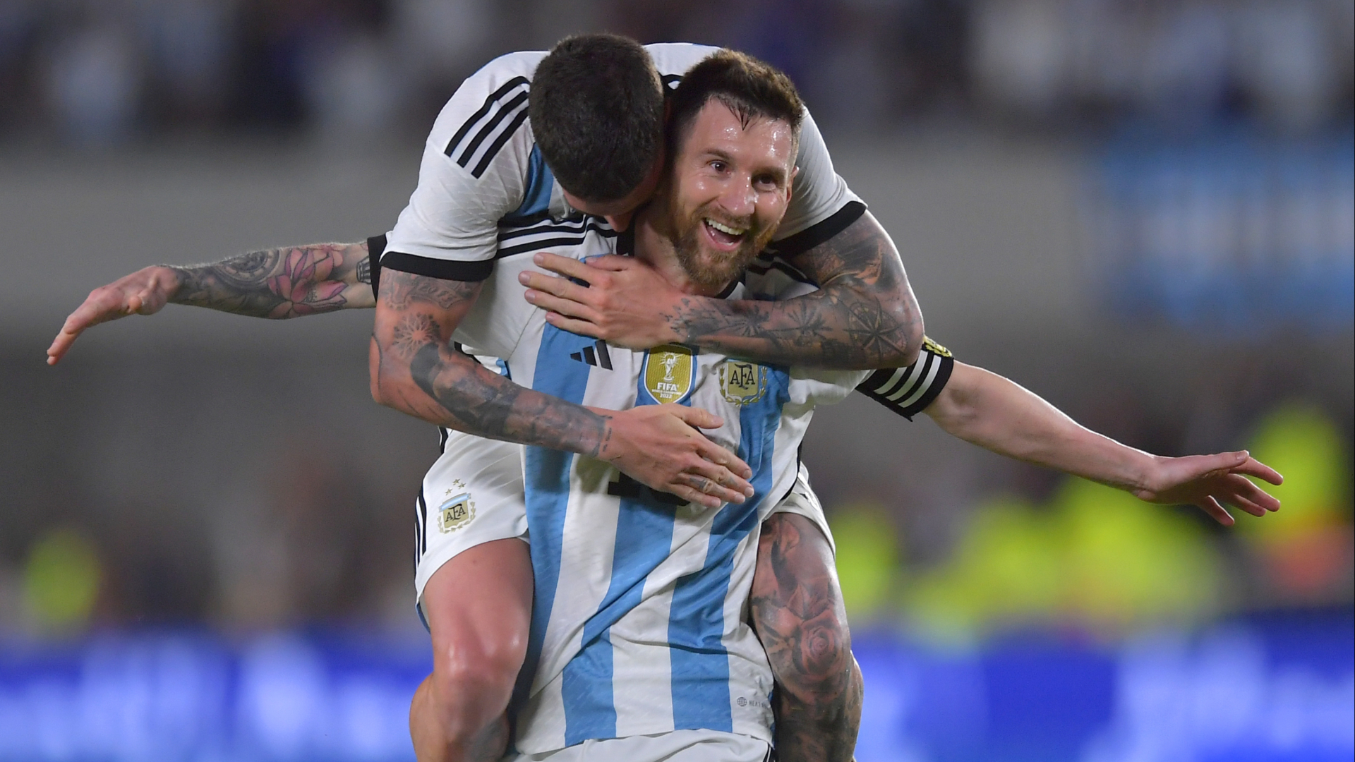 Rodrigo De Paul climbs on Lionel Messi to celebrate his free kick goal against Panama