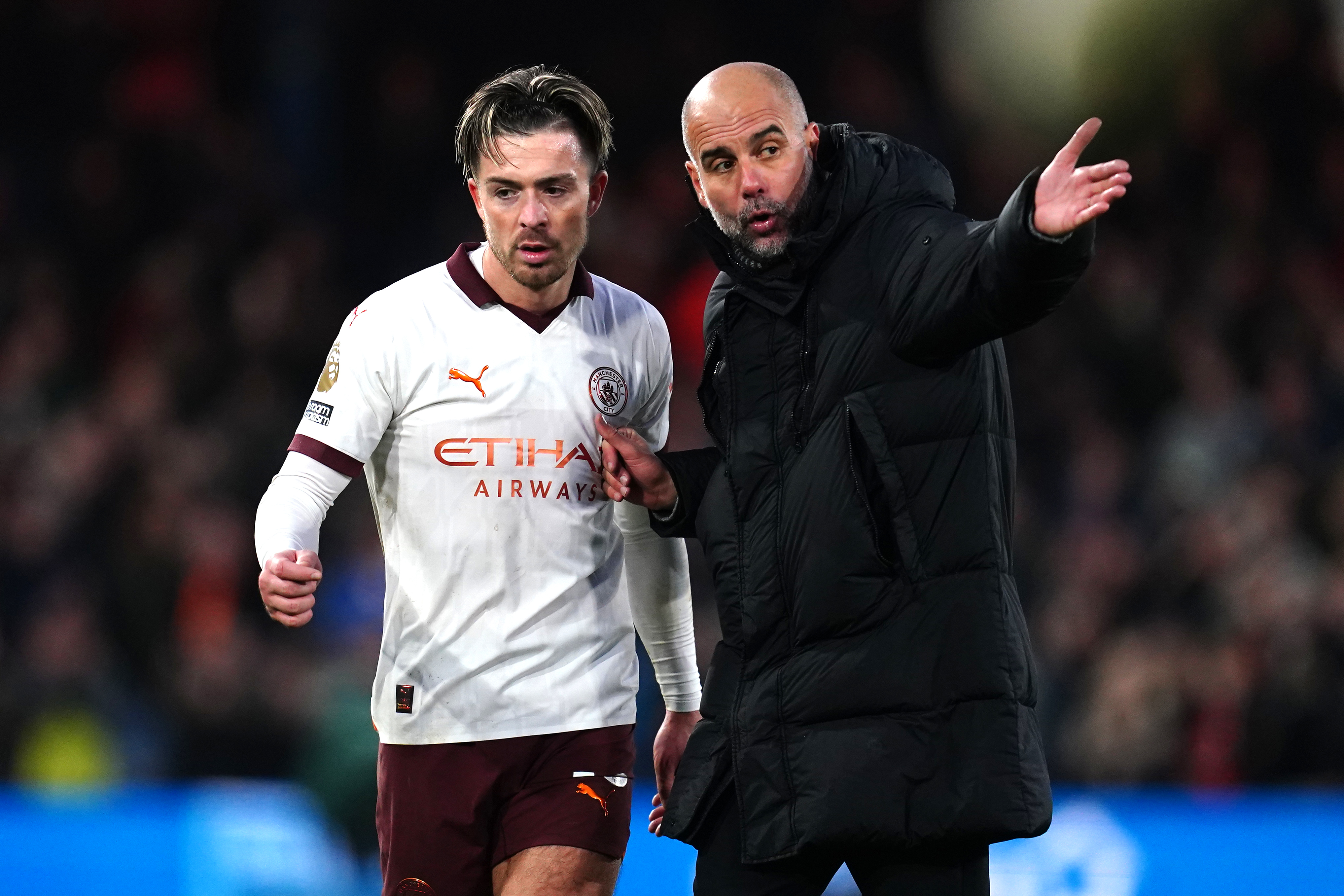 Jack Grealish and Pep Guardiola