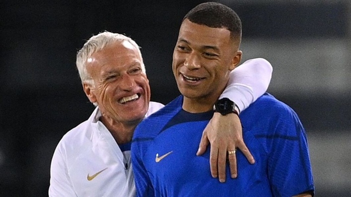 Didier Deschamps puts an arm around France striker Kylian Mbappe