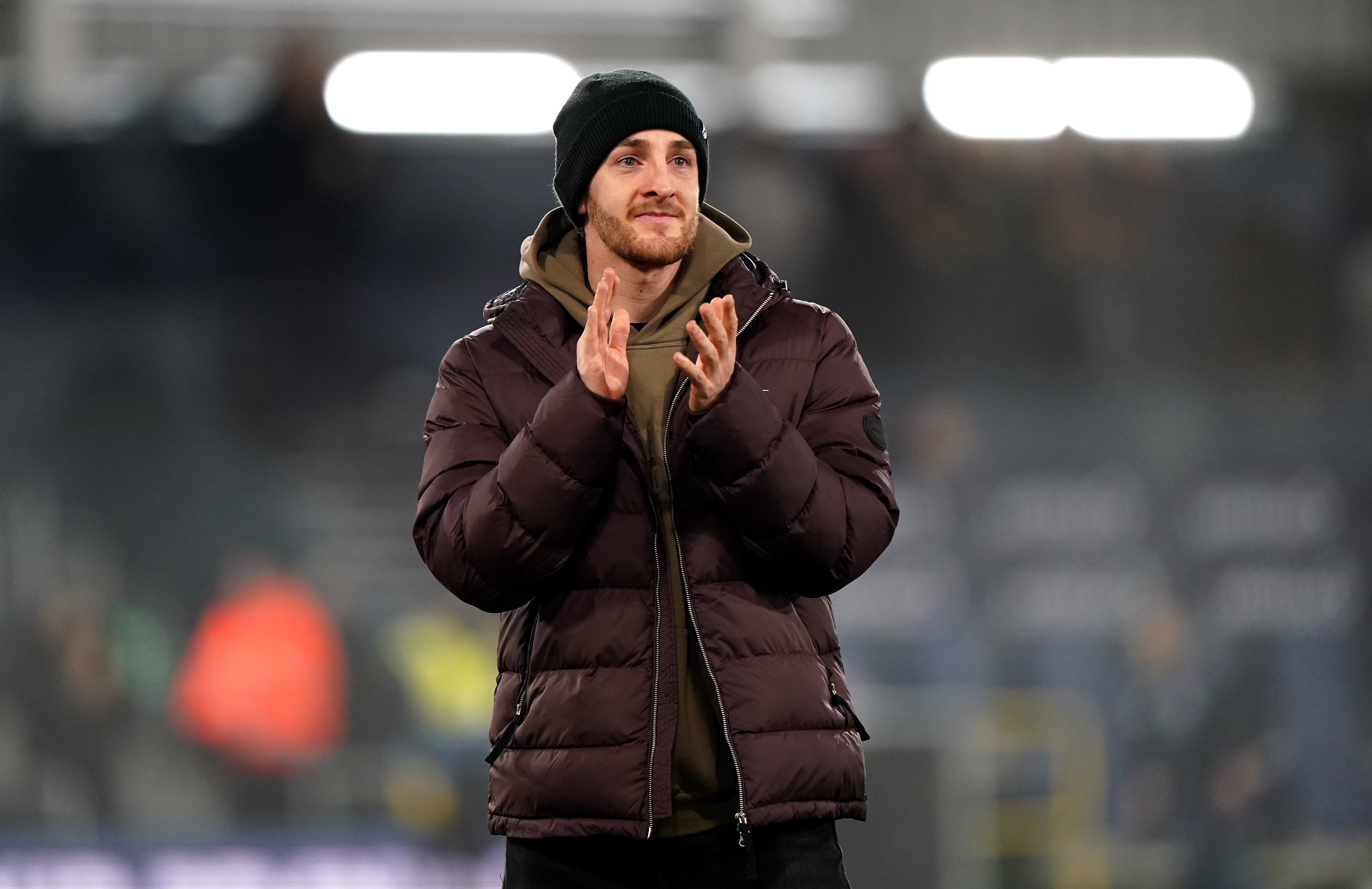 Luton defender Tom Lockyer applauds the fans