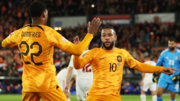 Memphis Depay (R) and Denzel Dumfries celebrate the Netherlands' first goal