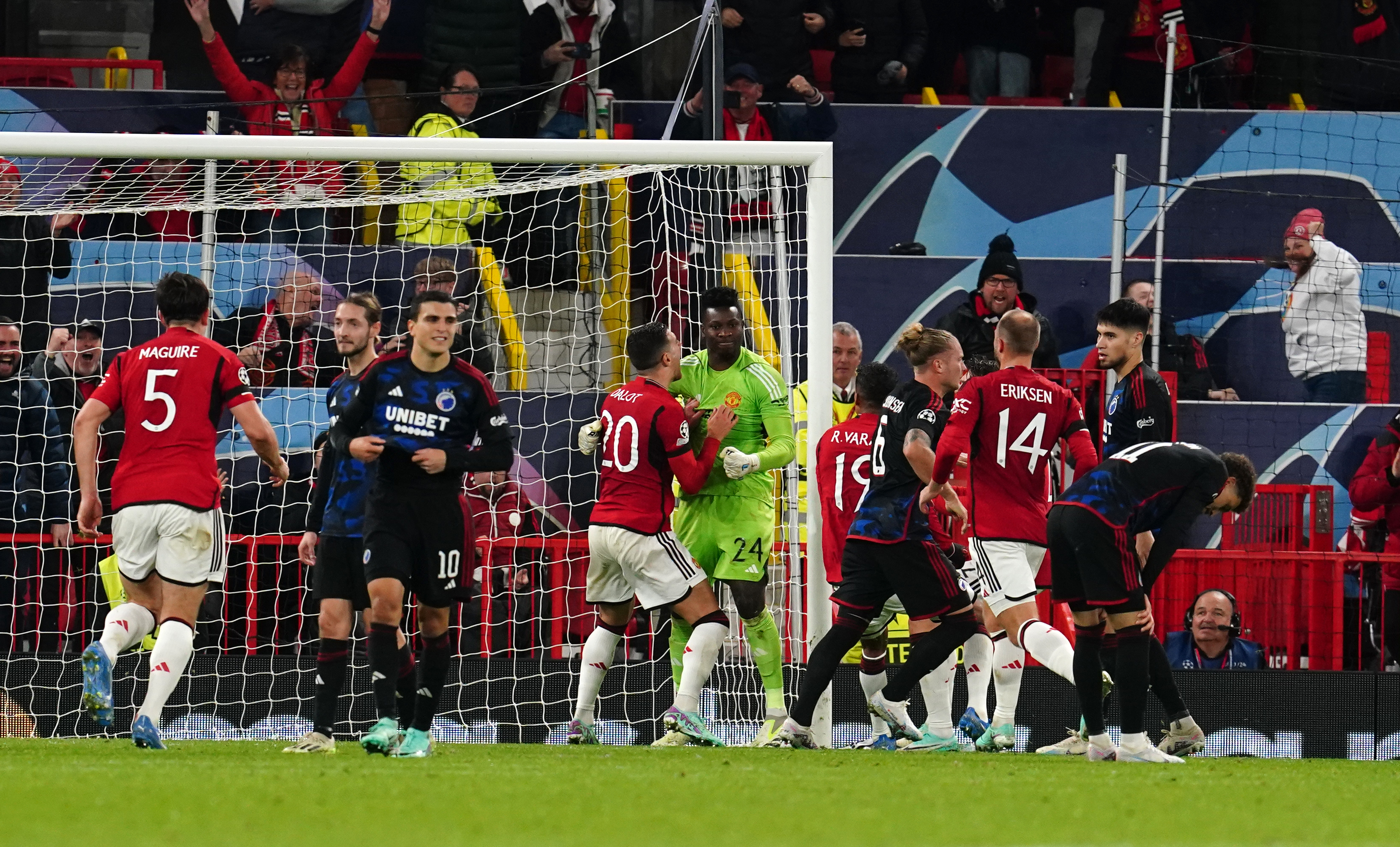 Andre Onana, centre, reacts after saving a penalty from FC Copenhagen’s Jordan Larsson, right