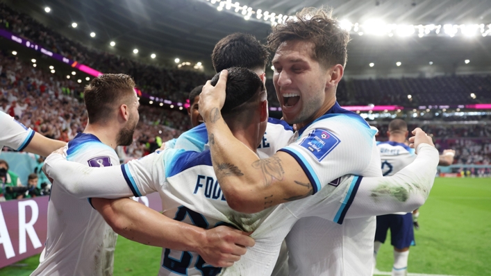 Phil Foden is embraced by John Stones after scoring against Wales