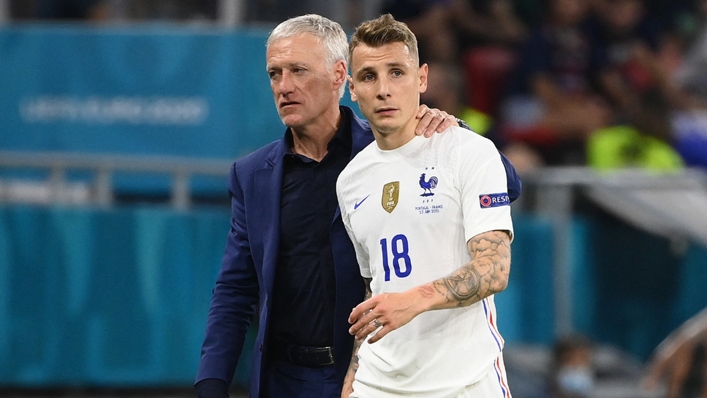 Didier Deschamps consoles Lucas Digne after the defender suffered an injuy against Portugal.