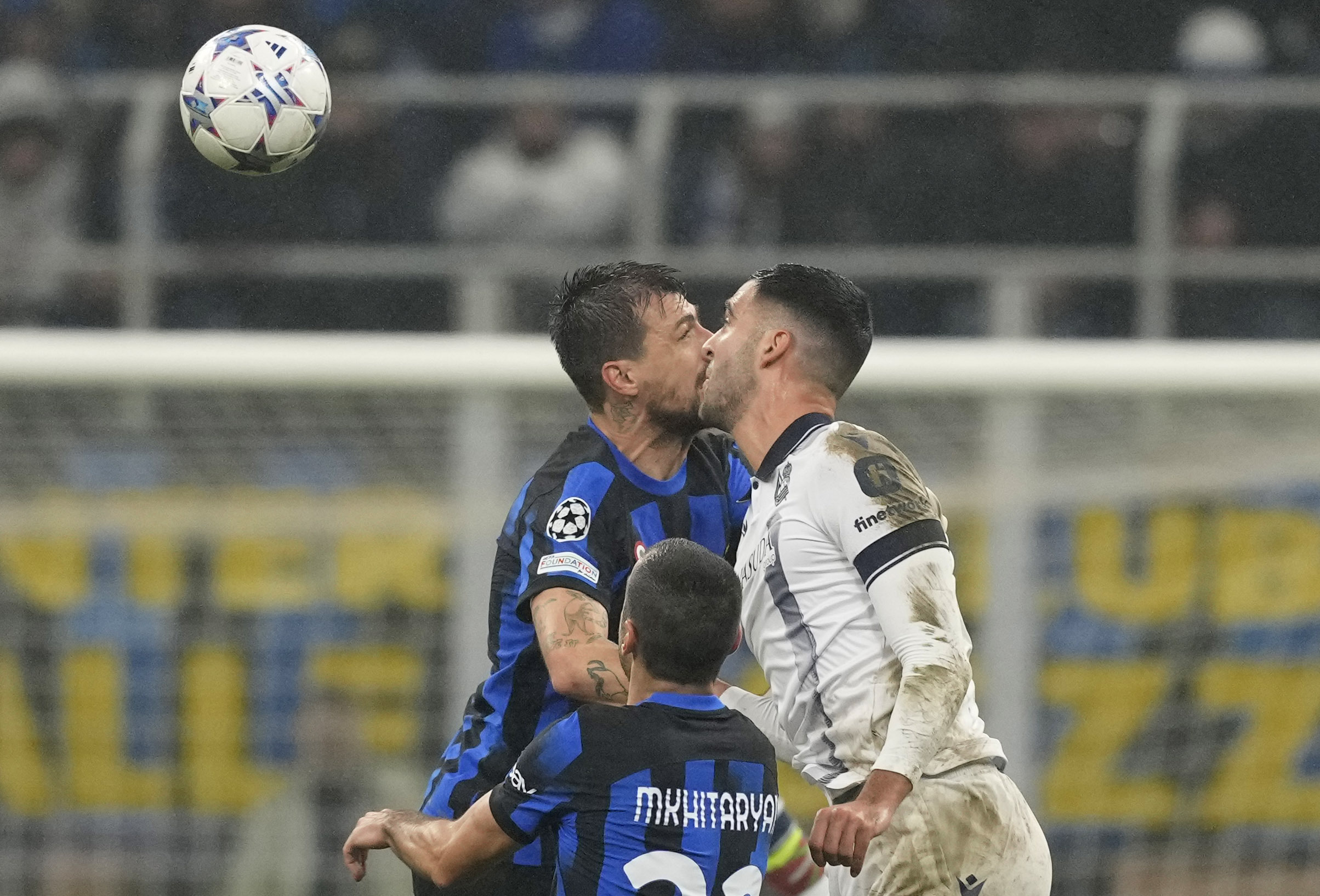Inter Milan’s Francesco Acerbi fights for the ball with Real Sociedad’s Igor Zubeldia