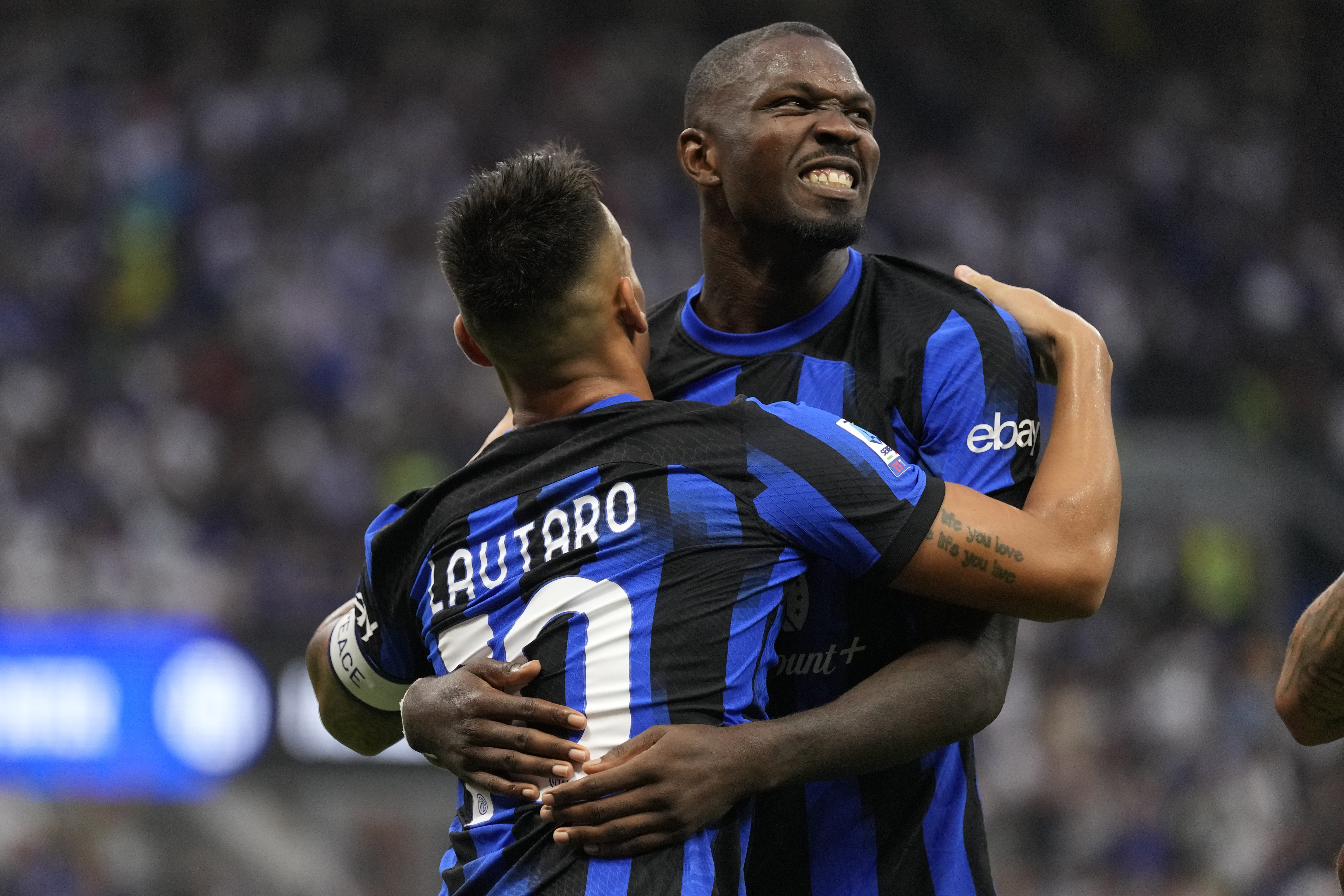 Lautaro Martinez (left) celebrates with Marcus Thuram